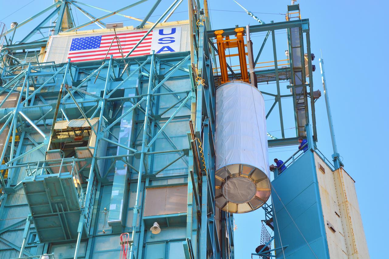 VANDENBERG AIR FORCE BASE, Calif. – At Vandenberg Air Force Base in California, NASA's Soil Moisture Active Passive mission, or SMAP, satellite is lifted at Space Launch Complex 2 for mating to its Delta II rocket.    SMAP will provide global measurements of soil moisture and its freeze/thaw state. These measurements will be used to enhance understanding of processes that link the water, energy and carbon cycles, and to extend the capabilities of weather and climate prediction models. SMAP data also will be used to quantify net carbon flux in boreal landscapes and to develop improved flood prediction and drought monitoring capabilities. Launch is scheduled for Jan. 29, 2015. To learn more about SMAP, visit http://smap.jpl.nasa.gov Photo credit: NASA/Randy Beaudoin