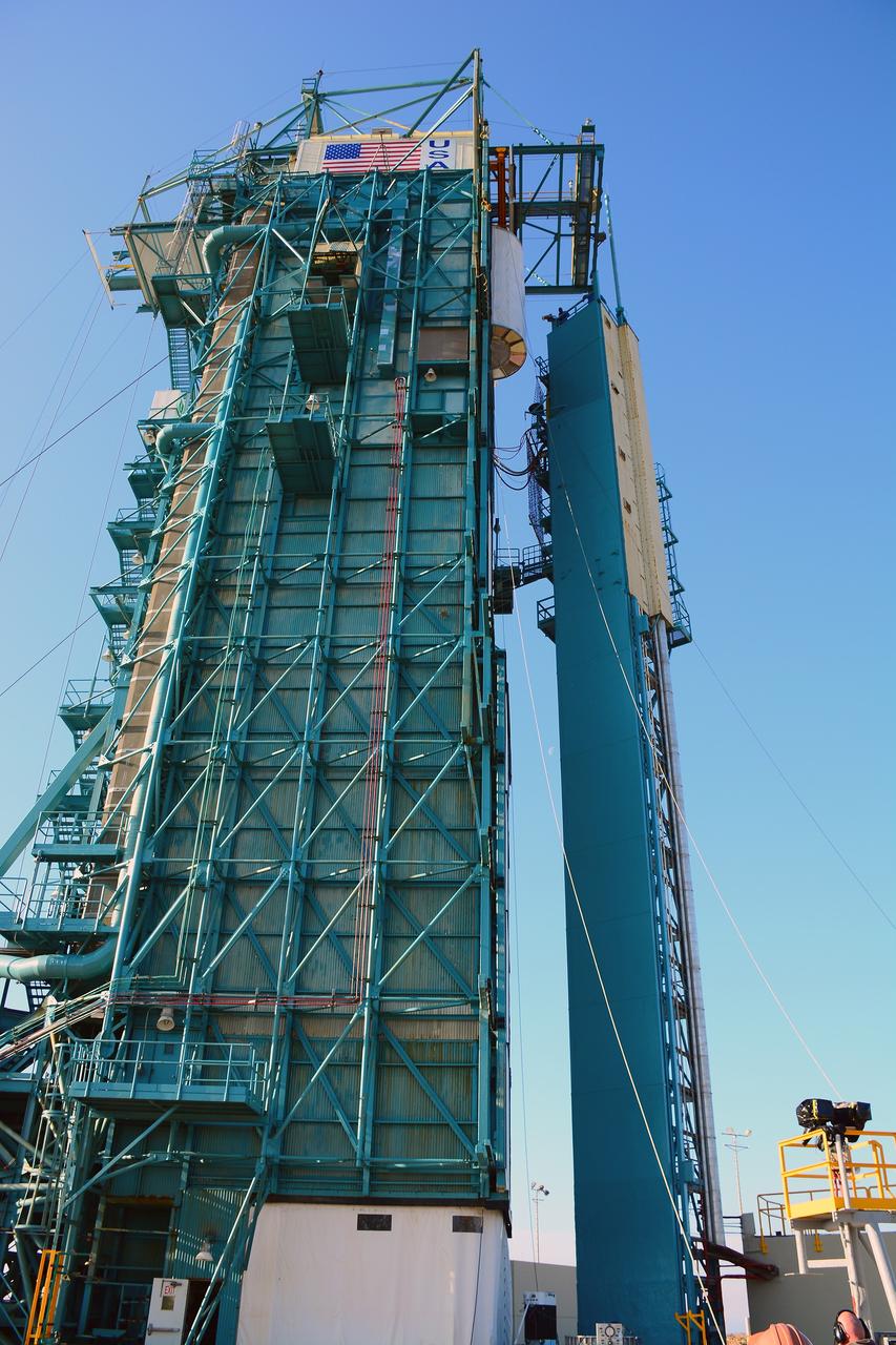 VANDENBERG AIR FORCE BASE, Calif. – At Vandenberg Air Force Base in California, NASA's Soil Moisture Active Passive mission, or SMAP, satellite is lifted at Space Launch Complex 2 for mating to its Delta II rocket.    SMAP will provide global measurements of soil moisture and its freeze/thaw state. These measurements will be used to enhance understanding of processes that link the water, energy and carbon cycles, and to extend the capabilities of weather and climate prediction models. SMAP data also will be used to quantify net carbon flux in boreal landscapes and to develop improved flood prediction and drought monitoring capabilities. Launch is scheduled for Jan. 29, 2015. To learn more about SMAP, visit http://smap.jpl.nasa.gov Photo credit: NASA/Randy Beaudoin