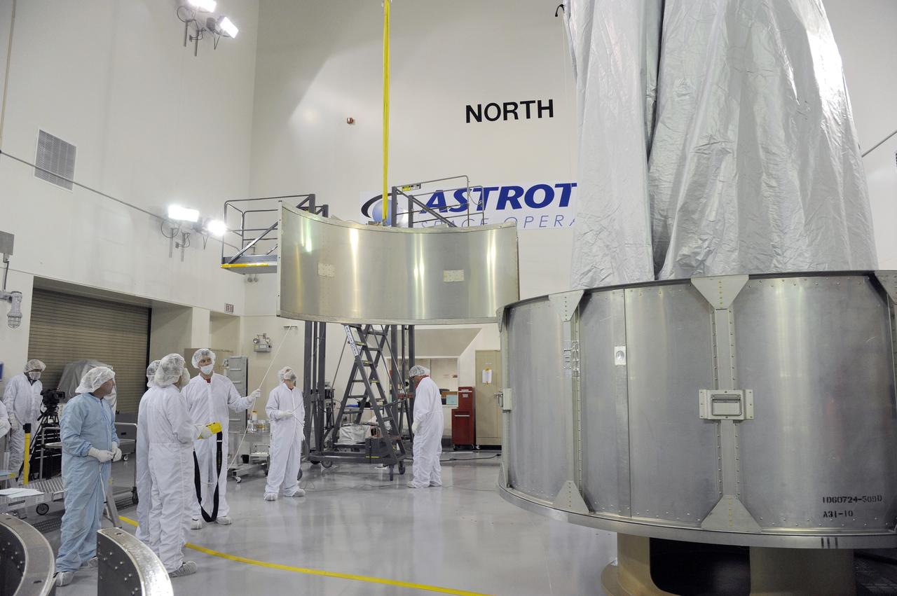 VANDENBERG AFB, California – Technicians and engineers place a transportation canister around NASA's SMAP spacecraft so it can be taken from the Astrotech processing facility to Space Launch Complex-2 for placement atop a Delta II rocket for launch. For more, go to www.nasa.gov/smap Photo credit: USAF/John Davila