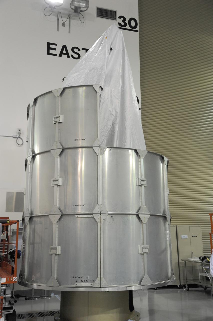 VANDENBERG AFB, California – Technicians and engineers place a transportation canister around NASA's SMAP spacecraft so it can be taken from the Astrotech processing facility to Space Launch Complex-2 for placement atop a Delta II rocket for launch. For more, go to www.nasa.gov/smap Photo credit: USAF/John Davila