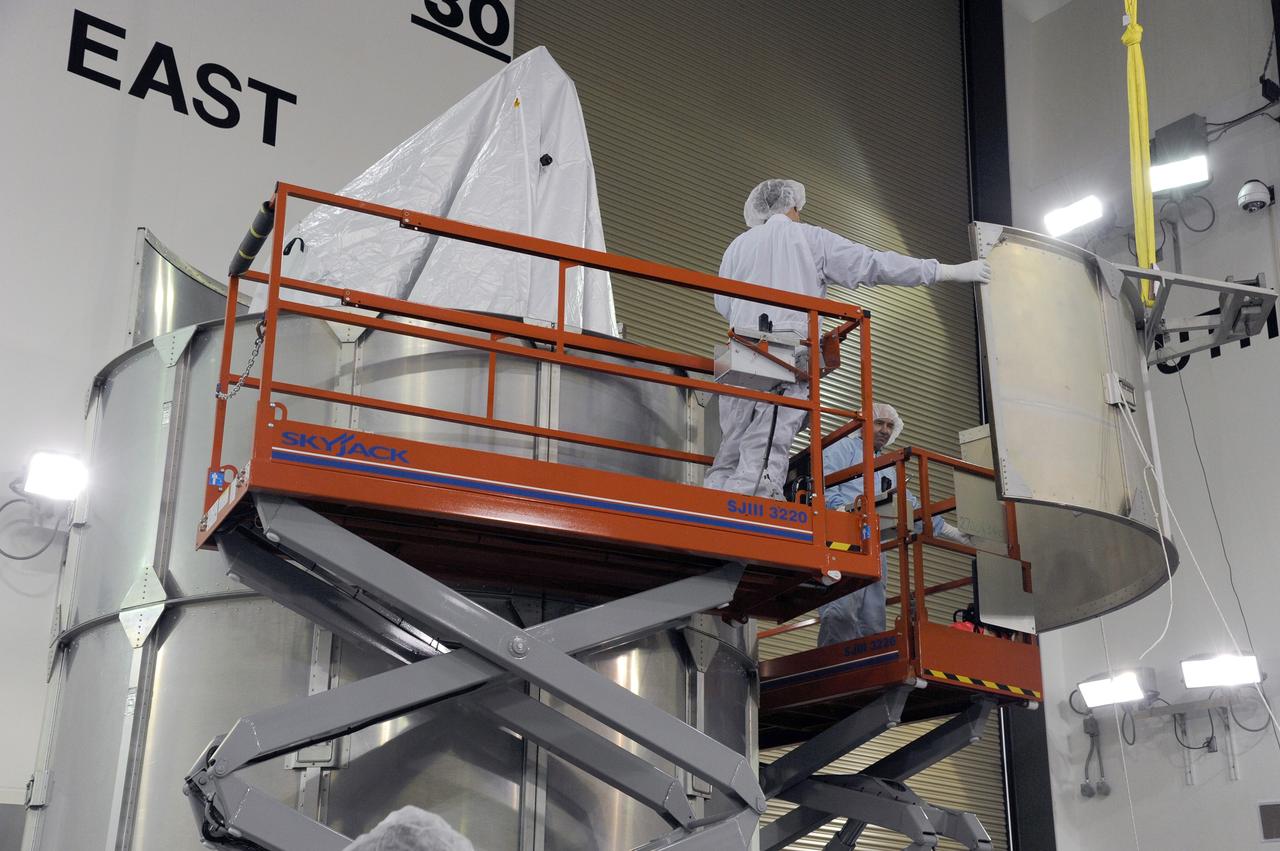 VANDENBERG AFB, California – Technicians and engineers place a transportation canister around NASA's SMAP spacecraft so it can be taken from the Astrotech processing facility to Space Launch Complex-2 for placement atop a Delta II rocket for launch. For more, go to www.nasa.gov/smap Photo credit: USAF/John Davila