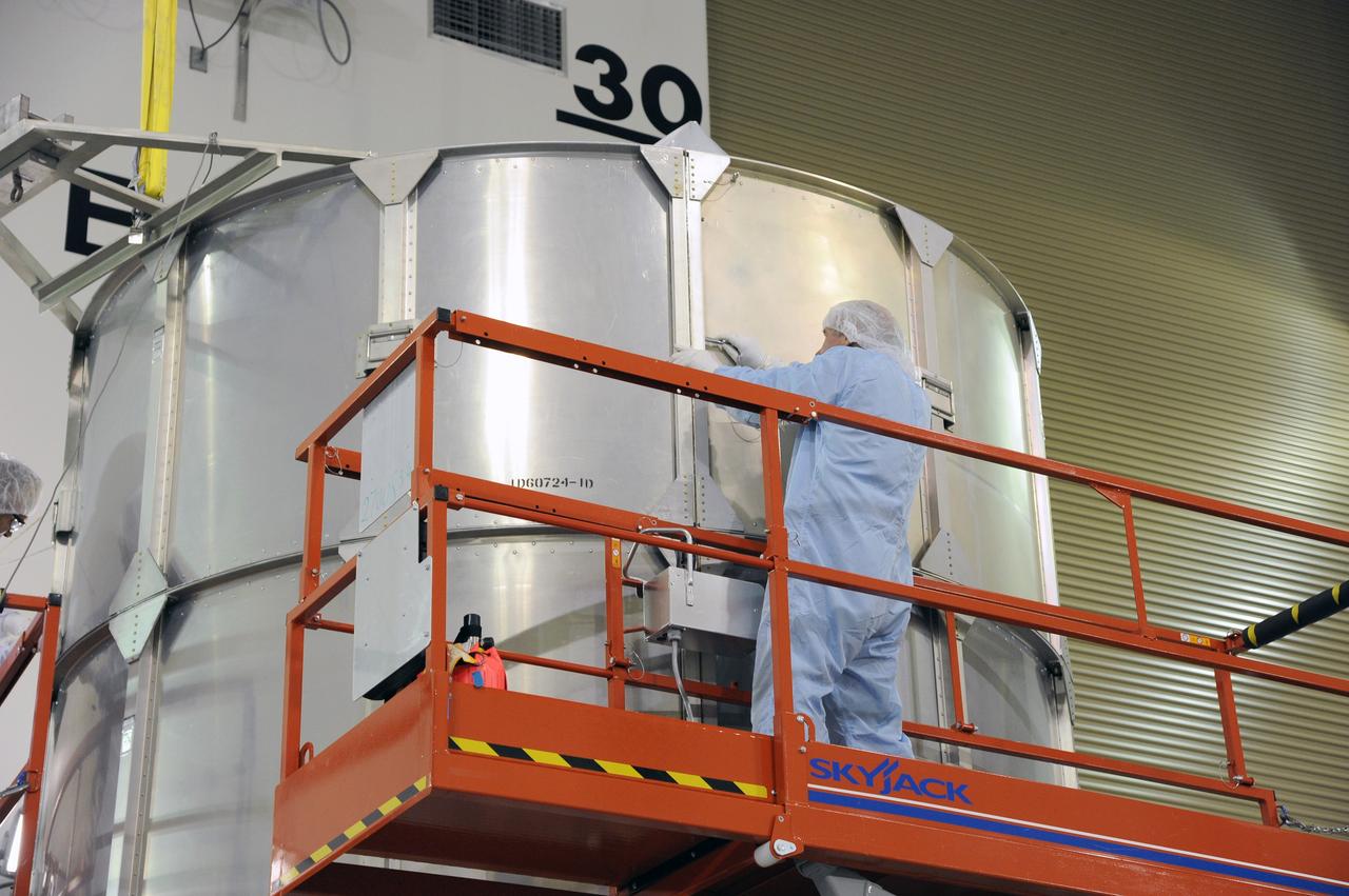 VANDENBERG AFB, California – Technicians and engineers place a transportation canister around NASA's SMAP spacecraft so it can be taken from the Astrotech processing facility to Space Launch Complex-2 for placement atop a Delta II rocket for launch. For more, go to www.nasa.gov/smap Photo credit: USAF/John Davila