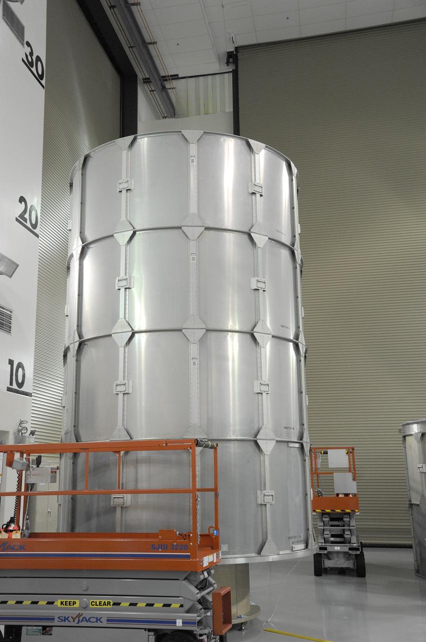 VANDENBERG AFB, California – Technicians and engineers place a transportation canister around NASA's SMAP spacecraft so it can be taken from the Astrotech processing facility to Space Launch Complex-2 for placement atop a Delta II rocket for launch. For more, go to www.nasa.gov/smap Photo credit: USAF/John Davila