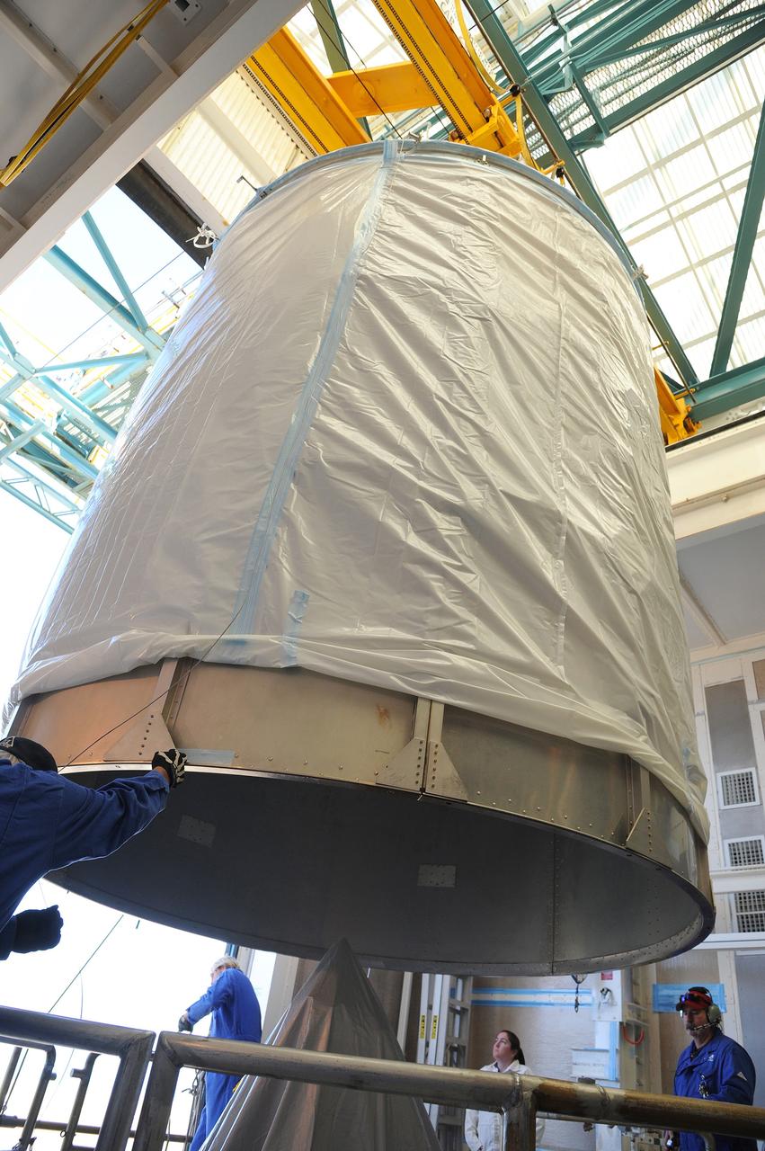 VANDENBERG AFB, California – The transportation canister is removed from around NASA's SMAP spacecraft after positioning the satellite atop a Delta II rocket at Space Launch Complex-2 for launch. For more, go to www.nasa.gov/smap Photo credit: USAF