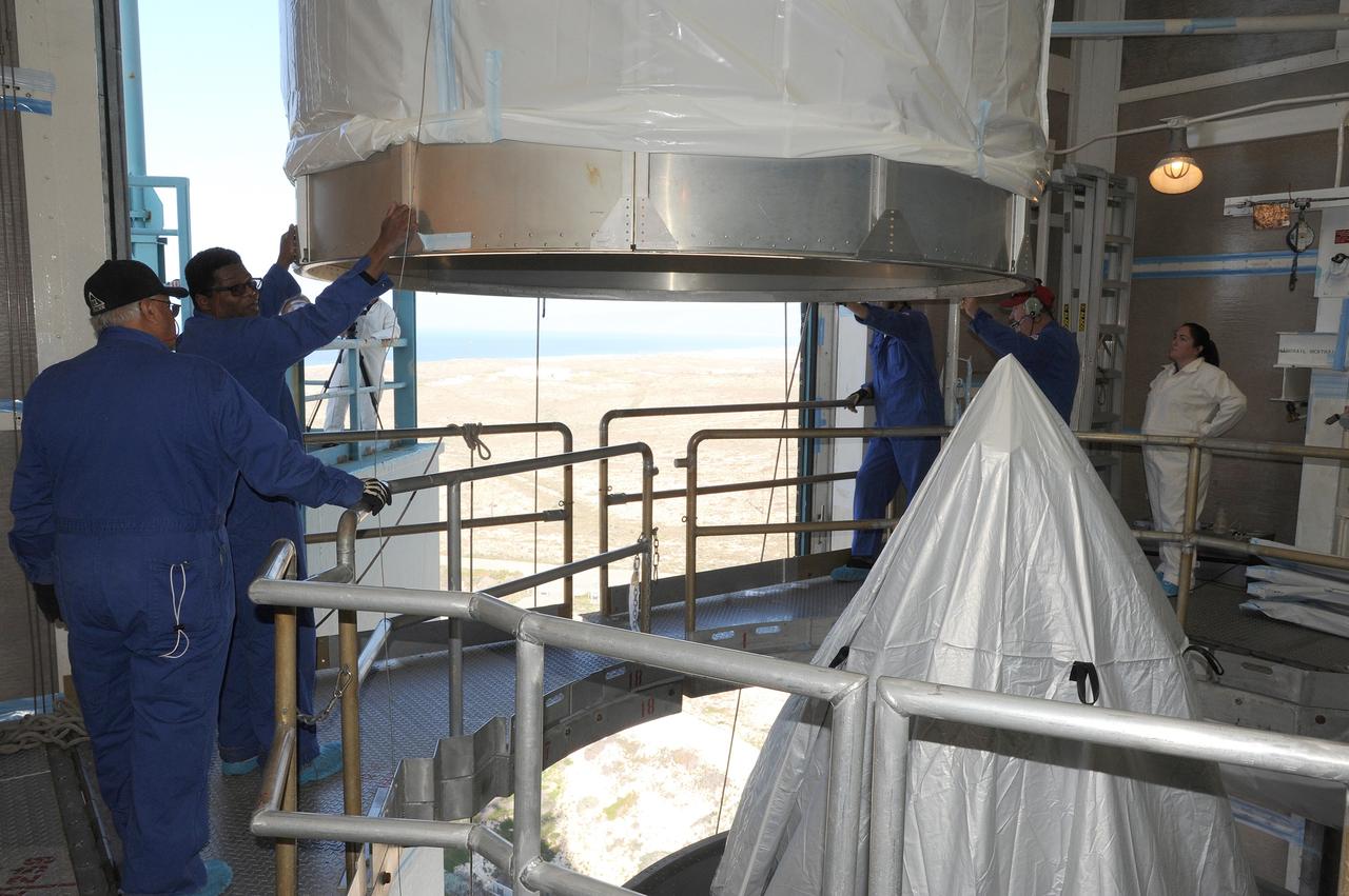 VANDENBERG AFB, California – The transportation canister is removed from around NASA's SMAP spacecraft after positioning the satellite atop a Delta II rocket at Space Launch Complex-2 for launch. For more, go to www.nasa.gov/smap Photo credit: USAF