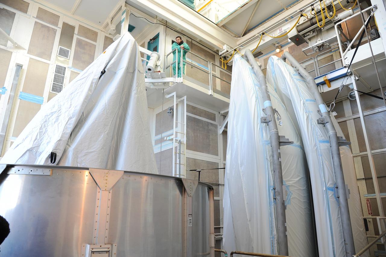 VANDENBERG AFB, California – The transportation canister is removed from around NASA's SMAP spacecraft after positioning the satellite atop a Delta II rocket at Space Launch Complex-2 for launch. For more, go to www.nasa.gov/smap Photo credit: USAF