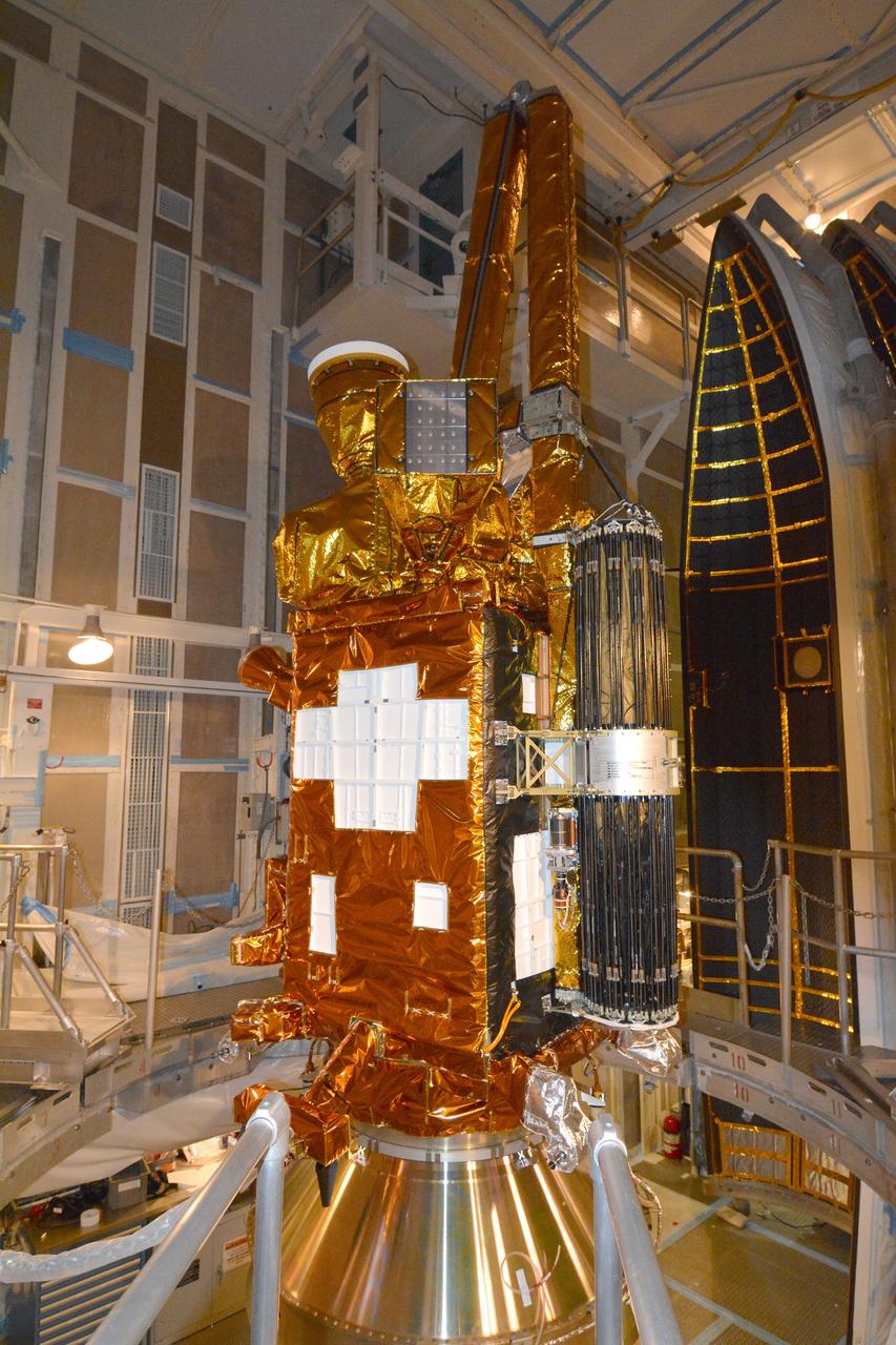 VANDENBERG AFB, California – NASA's SMAP spacecraft inside the service structure at Space Launch Complex-2 at Vandenberg AFB, California, as the payload fairing is prepared for attachment to the rocket to protect the spacecraft during launch and ascent. For more, go to www.nasa.gov/smap Photo credit: NASA/Randy Beaudoin