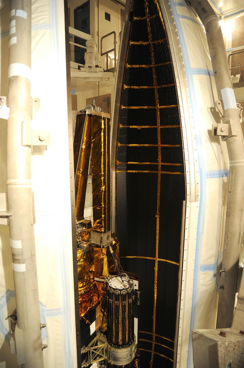 VANDENBERG AFB, California – The payload fairing is moved into place around NASA's SMAP spacecraft inside the service structure at Space Launch Complex-2 at Vandenberg AFB, California - the launch site for NASA's SMAP spacecraft. For more, go to www.nasa.gov/smap Photo credit: USAF