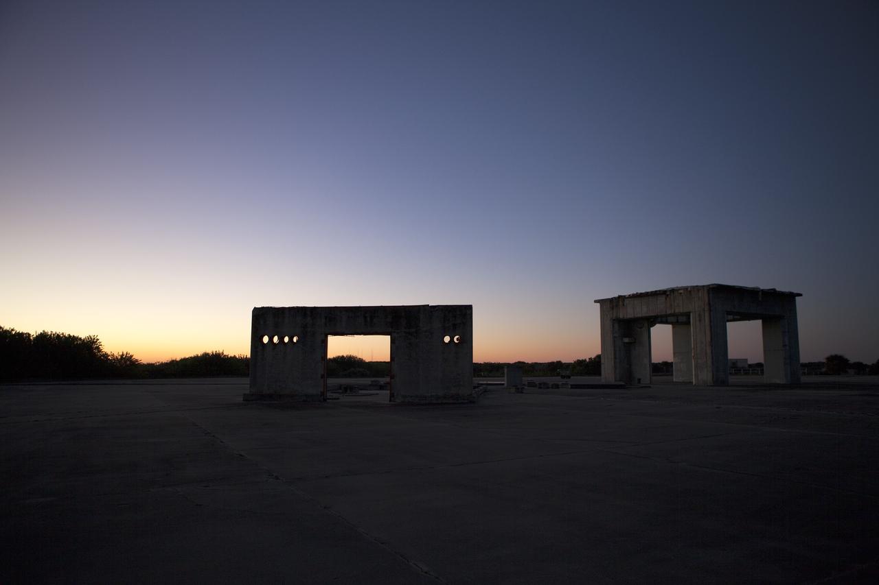 CAPE CANAVERAL, Fla. – The sun rises over what remains of the historic gantry and support structures on Launch Pad 34 on Cape Canaveral Air Force Station in Florida.    On this day in 1967, a fire erupted on the pad during a preflight test, taking the lives of the Apollo 1 crew, NASA astronauts Virgil Grissom, Edward White and Roger Chaffee. To learn more about Apollo 1 and the crew, visit http://www.nasa.gov/mission_pages/apollo/missions/apollo1.html.  Photo credit: NASA/Ben Smegelsky