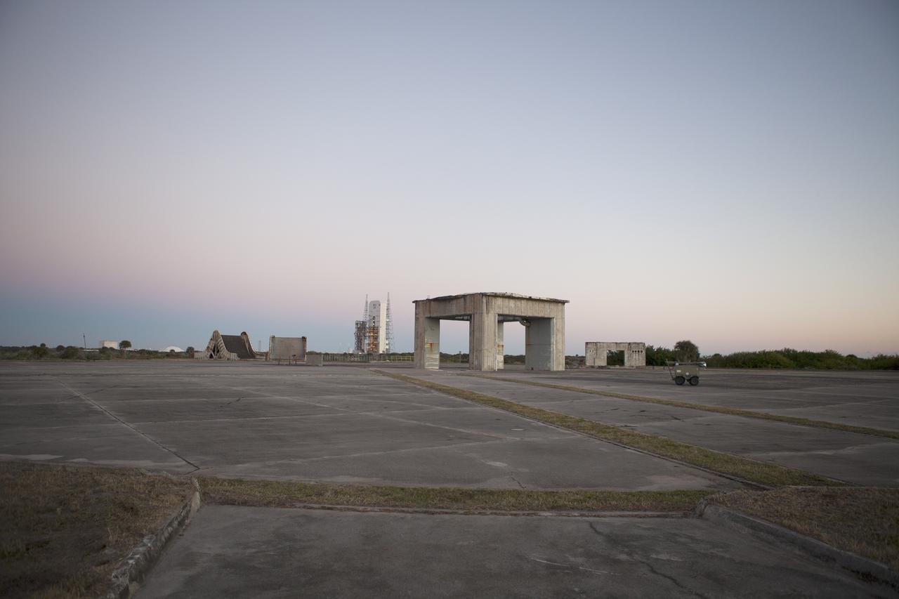 CAPE CANAVERAL, Fla. – The past intersects with the future on Cape Canaveral Air Force Station in Florida. In the foreground is what remains of historic Launch Pad 34 in the distance behind it is Space Launch Complex 37 whence NASA's Orion spacecraft made its first flight test.     On this day in 1967, a fire erupted on the Pad 34 during a preflight test, taking the lives of the Apollo 1 crew, NASA astronauts Virgil Grissom, Edward White and Roger Chaffee. To learn more about Apollo 1 and the crew, visit http://www.nasa.gov/mission_pages/apollo/missions/apollo1.html.  To learn more about Orion, visit http://www.nasa.gov/exploration/systems/orion/. Photo credit: NASA/Ben Smegelsky