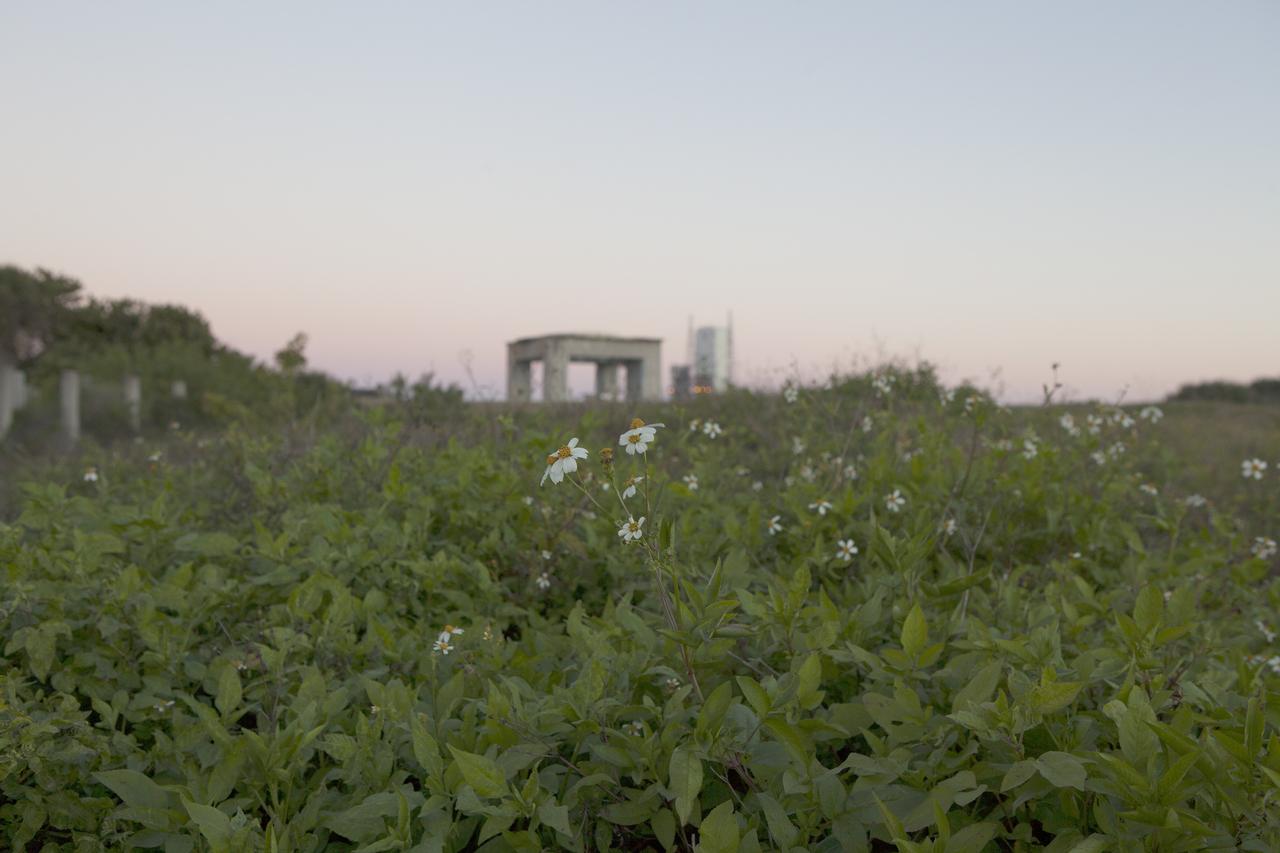 CAPE CANAVERAL, Fla. – The past intersects with the future on Cape Canaveral Air Force Station in Florida. In the foreground is what remains of historic Launch Pad 34 in the distance behind it is Space Launch Complex 37 whence NASA's Orion spacecraft made its first flight test.    On this day in 1967, a fire erupted on the Pad 34 during a preflight test, taking the lives of the Apollo 1 crew, NASA astronauts Virgil Grissom, Edward White and Roger Chaffee. To learn more about Apollo 1 and the crew, visit http://www.nasa.gov/mission_pages/apollo/missions/apollo1.html.  To learn more about Orion, visit http://www.nasa.gov/exploration/systems/orion/. Photo credit: NASA/Ben Smegelsky