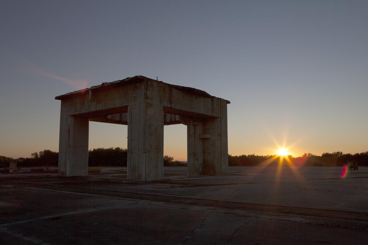 CAPE CANAVERAL, Fla. – The sun comes up behind what remains of the gantry on Launch Pad 34 on Cape Canaveral Air Force Station in Florida.     On this day in 1967, a fire erupted on the pad during a preflight test, taking the lives of the Apollo 1 crew, NASA astronauts Virgil Grissom, Edward White and Roger Chaffee. To learn more about Apollo 1 and the crew, visit http://www.nasa.gov/mission_pages/apollo/missions/apollo1.html.  Photo credit: NASA/Ben Smegelsky