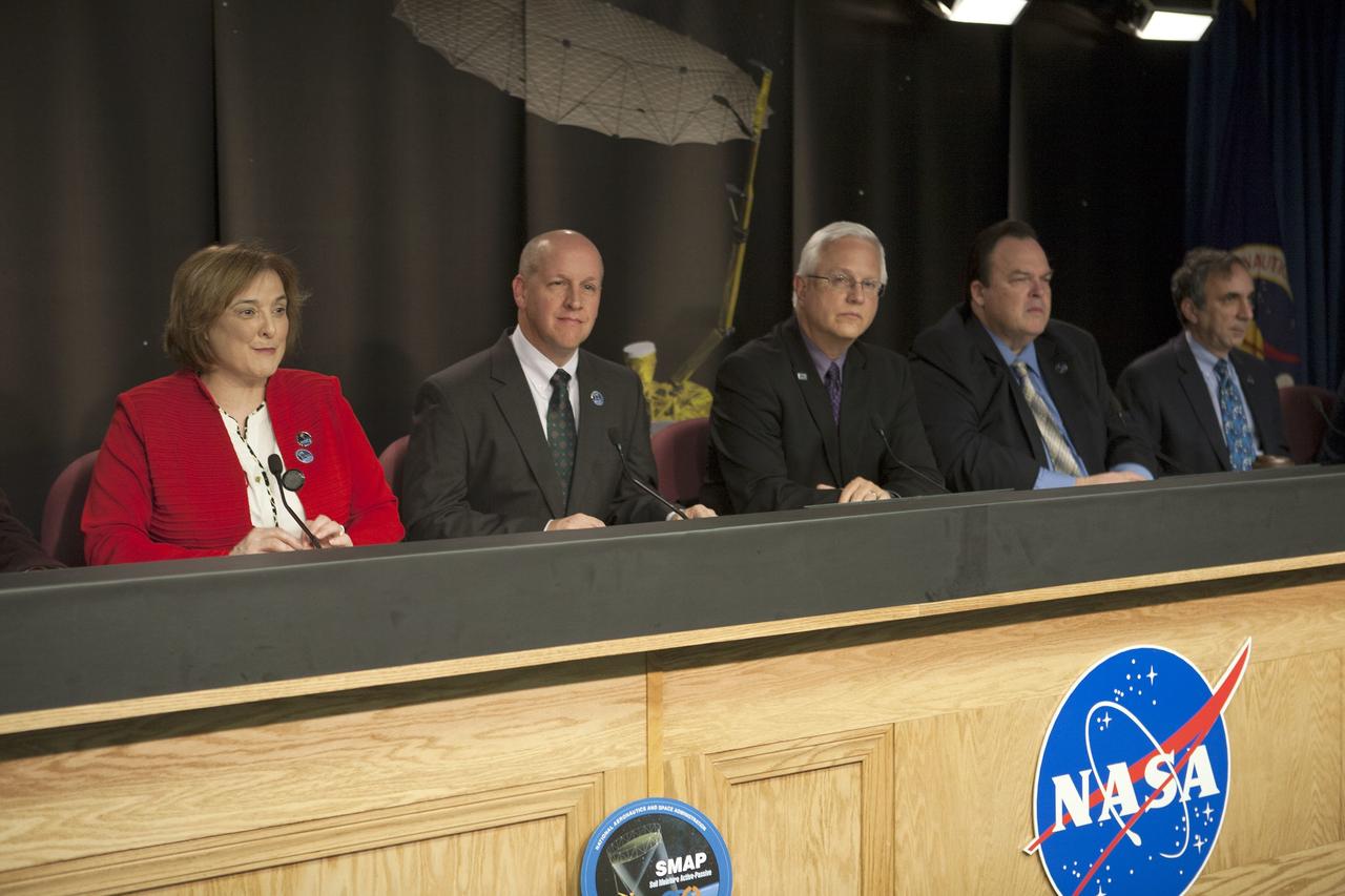 VANDENBERG AIR FORCE BASE, California – At Vandenberg Air Force Base, California, agency and industry leaders spoke to members of the news media as the Soil Moisture Active Passive, or SMAP, satellite and its Delta II rocket were being prepared for launch. From left are: Christine Bonniksen, SMAP program executive at NASA Headquarters, Tim Dunn, NASA launch manager at Kennedy Space Center, Florida, Vern Thorp, program manager for NASA Missions for United Launch Alliance in Centennial, Colorado, Kent Kellogg, SMAP Project manager at the Jet Propulsion Laboratory in Pasadena, California, Dara Entekhabi, SMAP science team leader at the Massachusetts Institute of Technology in Cambridge, Massachusetts, and 1st Lt. John Martin, launch weather officer, 30th Operations Support Squadron at Vandenberg. Photo credit: NASA/Kim Shiflett