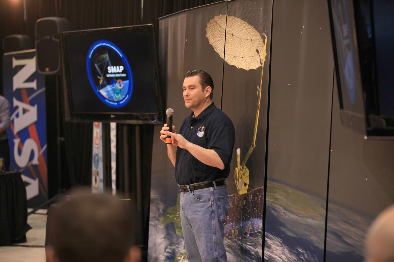 VANDENBERG AIR FORCE BASE, Calif. – Jared Entin, program scientist for NASA's Soil Moisture Active Passive mission, or SMAP, discusses the science and engineering of the mission with the audience of a NASA Social held at Vandenberg Air Force Base in California. This NASA Social brought together mission scientists and engineers with an audience of 70 students, educators, social media managers, bloggers, photographers and videographers who were selected from a pool of 325 applicants from 45 countries to participate in launch activities and communicate their experience with social media followers. The SMAP mission is scheduled to launch from Vandenberg on Jan. 29. To learn more about SMAP, visit http://www.nasa.gov/smap. Photo credit: NASA/Kim Shiflett