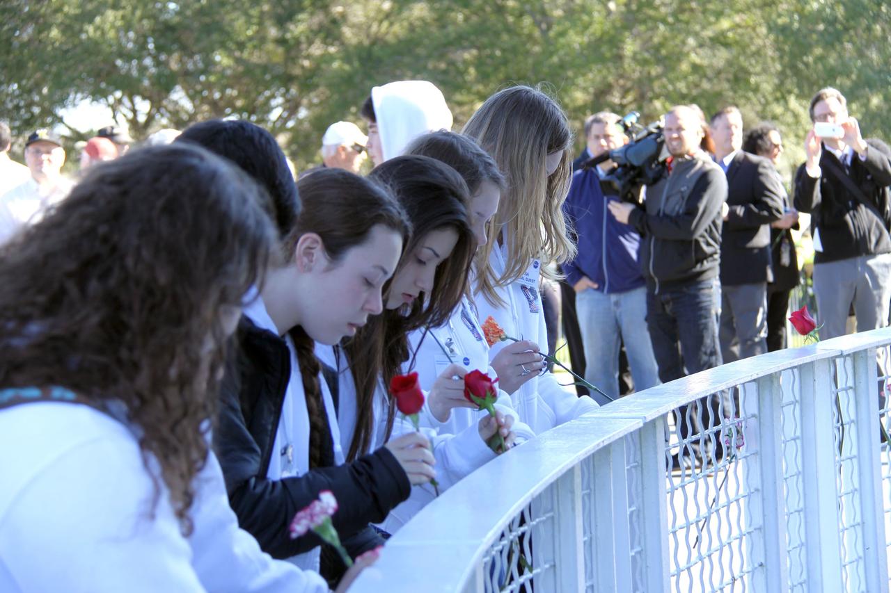 CAPE CANAVERAL, Fla. – NASA’s Kennedy Space Center in Florida paid tribute to the crews of Apollo 1 and space shuttles Challenger and Columbia, as well as other NASA astronauts who lost their lives while furthering the cause of exploration and discovery, during the agency's Day of Remembrance, Jan. 28.  Kennedy workers and guests left roses at the Space Mirror Memorial located in the Kennedy Space Center Visitor Complex. Photo credit: NASA/Jim Grossmann