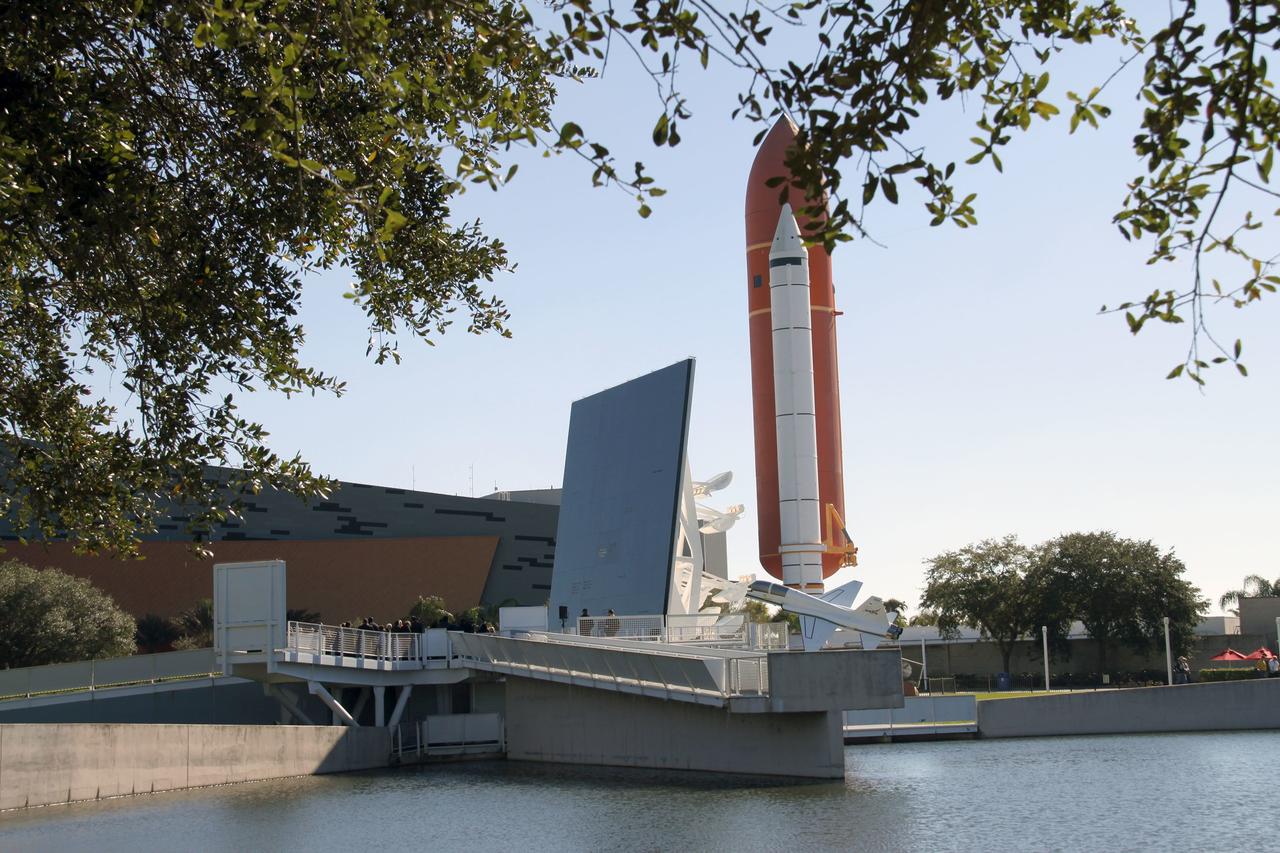 CAPE CANAVERAL, Fla. – NASA’s Kennedy Space Center in Florida paid tribute to the crews of Apollo 1 and space shuttles Challenger and Columbia, as well as other NASA astronauts who lost their lives while furthering the cause of exploration and discovery, during the agency's Day of Remembrance, Jan. 28. A wreath-laying ceremony was held at the Space Mirror Memorial located in the Kennedy Space Center Visitor Complex. Behind the memorial, the full-size mock-up of the external fuel tank and solid rocket boosters mark the entrance to the Space Shuttle Atlantis exhibit. Photo credit: NASA/Jim Grossmann