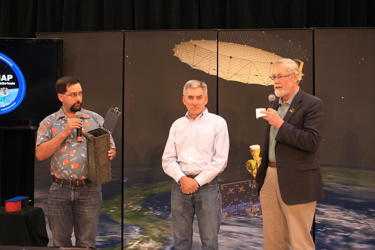 VANDENBERG AIR FORCE BASE, Calif. – From left, John Bellardo, co-principal investigator Cubesat at California Polytechnic, San Luis Obispo, David Rider, GRIFEX principal investigator at Jet Propulsion Laboratory, Pasadena, California, and Dave Klumpar, Firebird-II principal investigator and director of the Space Science and Engineering Laboratory at Montana State University in Bozeman, Montana, discuss three Educational Launch of Nanosatellites ELaNa CubeSat that are being flown as auxiliary payloads on NASA's Soil Moisture Active Passive mission, or SMAP, with the audience of a NASA Social held for at Vandenberg Air Force Base in California. This NASA Social brought together mission scientists and engineers with an audience of 70 students, educators, social media managers, bloggers, photographers and videographers who were selected from a pool of 325 applicants from 45 countries to participate in launch activities and communicate their experience with social media followers. The SMAP mission is scheduled to launch from Vandenberg on Jan. 29. To learn more about SMAP, visit http://www.nasa.gov/smap.  Photo credit: NASA/Kim Shiflett