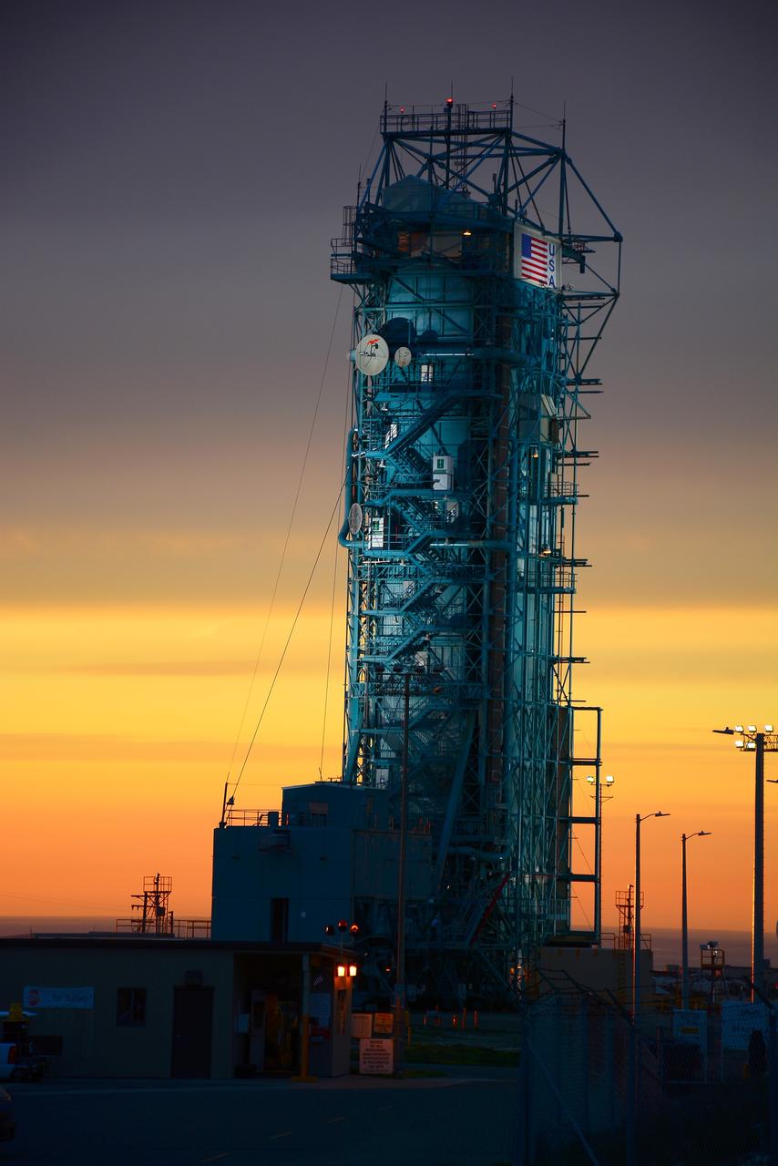 VANDENBERG AIR FORCE BASE, Calif. – The sun sets over the West Cost prior to the launch gantry being rolled back to reveal the United Launch Alliance Delta II rocket with the Soil Moisture Active Passive, or SMAP, satellite aboard, at the Space Launch Complex 2 at Vandenberg Air Force Base, California. SMAP is a remote sensing mission designed to measure and map the Earth's soil moisture distribution and freeze/thaw stat with unprecedented accuracy, resolution and coverage.    SMAP will provide global measurements of soil moisture and its freeze/thaw state. These measurements will be used to enhance understanding of processes that link the water, energy and carbon cycles, and to extend the capabilities of weather and climate prediction models. SMAP data also will be used to quantify net carbon flux in boreal landscapes and to develop improved flood prediction and drought monitoring capabilities. Launch is scheduled for Jan. 29, 2015. To learn more about SMAP, visit http://smap.jpl.nasa.gov Photo credit: NASA/Randy Beaudoin