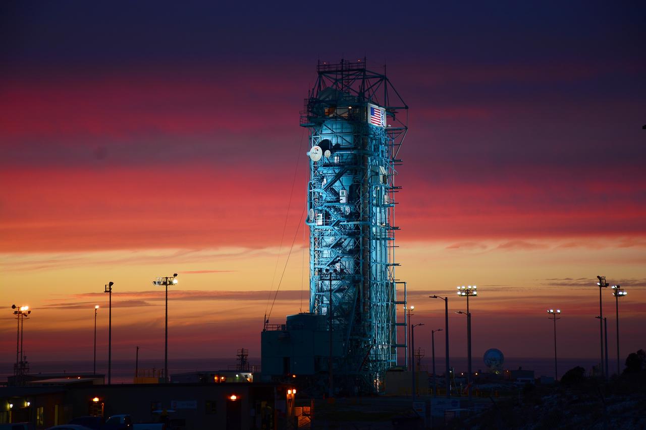 VANDENBERG AIR FORCE BASE, Calif. – The sun sets over the West Cost prior to the launch gantry being rolled back to reveal the United Launch Alliance Delta II rocket with the Soil Moisture Active Passive, or SMAP, satellite aboard, at the Space Launch Complex 2 at Vandenberg Air Force Base, California. SMAP is a remote sensing mission designed to measure and map the Earth's soil moisture distribution and freeze/thaw stat with unprecedented accuracy, resolution and coverage.    SMAP will provide global measurements of soil moisture and its freeze/thaw state. These measurements will be used to enhance understanding of processes that link the water, energy and carbon cycles, and to extend the capabilities of weather and climate prediction models. SMAP data also will be used to quantify net carbon flux in boreal landscapes and to develop improved flood prediction and drought monitoring capabilities. Launch is scheduled for Jan. 29, 2015. To learn more about SMAP, visit http://smap.jpl.nasa.gov Photo credit: NASA/Randy Beaudoin