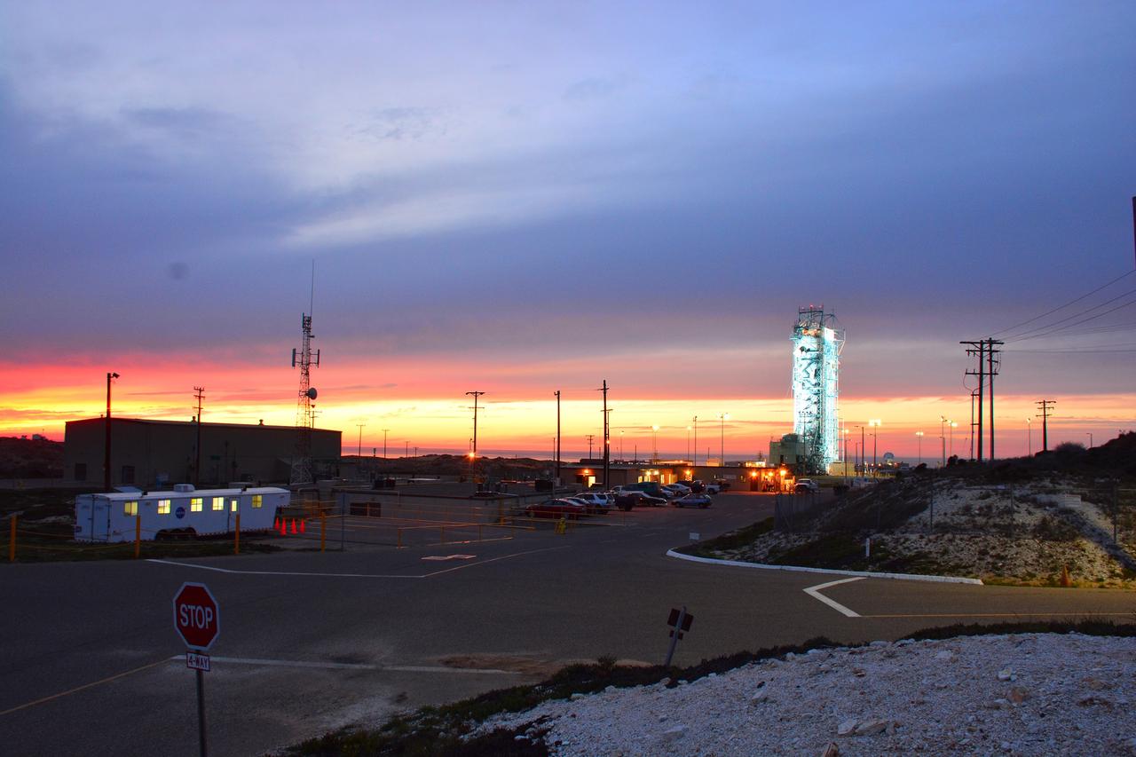 VANDENBERG AIR FORCE BASE, Calif. – The sun sets over the West Cost prior to the launch gantry being rolled back to reveal the United Launch Alliance Delta II rocket with the Soil Moisture Active Passive, or SMAP, satellite aboard, at the Space Launch Complex 2 at Vandenberg Air Force Base, California. SMAP is a remote sensing mission designed to measure and map the Earth's soil moisture distribution and freeze/thaw stat with unprecedented accuracy, resolution and coverage.    SMAP will provide global measurements of soil moisture and its freeze/thaw state. These measurements will be used to enhance understanding of processes that link the water, energy and carbon cycles, and to extend the capabilities of weather and climate prediction models. SMAP data also will be used to quantify net carbon flux in boreal landscapes and to develop improved flood prediction and drought monitoring capabilities. Launch is scheduled for Jan. 29, 2015. To learn more about SMAP, visit http://smap.jpl.nasa.gov Photo credit: NASA/Randy Beaudoin