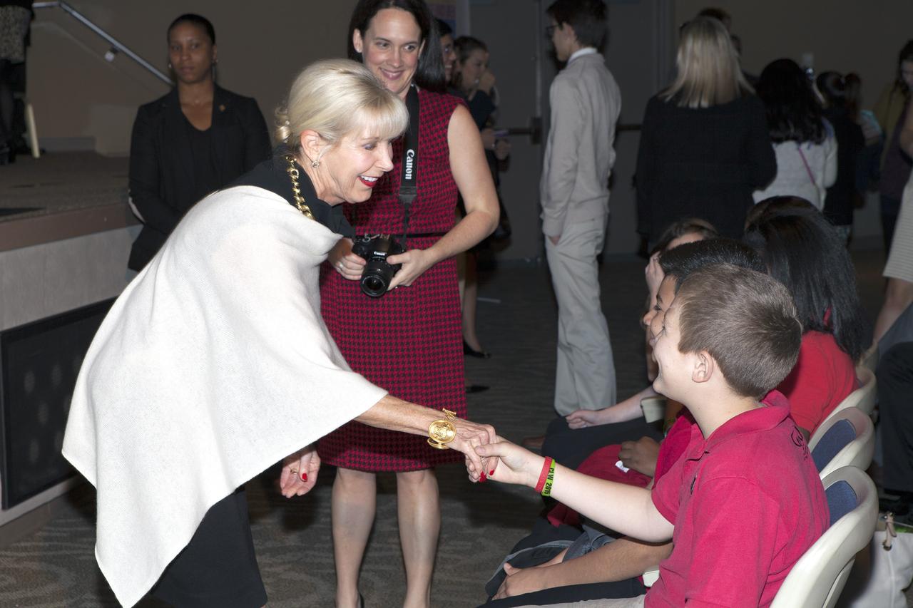 CAPE CANAVERAL, Fla. – First Lady of the State of Florida Ann Scott greets students inside the Astronaut Encounter Theater at NASA’s Kennedy Space Center in Florida during the 2015 Celebrate Literacy Week Florida PSA Awards program. The event, hosted by the Florida Department of Education, announced the winning entries from elementary, middle and high school students that best encouraged literacy and its connection to space careers. Photo credit: NASA/Ben Smegelsky