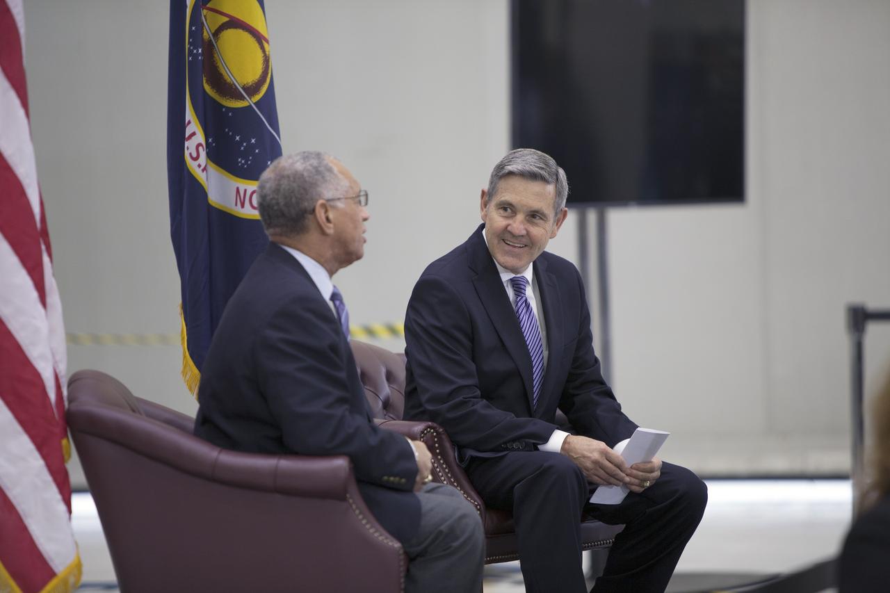 CAPE CANAVERAL, Fla. – In the Neil Armstrong Operations and Checkout Building high bay at NASA's Kennedy Space Center in Florida, NASA Administrator Charlie Bolden and Kennedy Space Center Director Bob Cabana have a few moments to consult before NASA's televised fiscal year 2016 budget rollout event. Bolden will deliver a "state of the agency" address. Representatives from the Kennedy workforce, news media and social media were in attendance. NASA's Orion, SpaceX Dragon and Boeing CST-100 spacecraft, all destined to play a role in NASA’s overall exploration objectives, were on display.  For information on NASA's budget, visit http://www.nasa.gov/budget. Photo credit: NASA/Gianni Woods