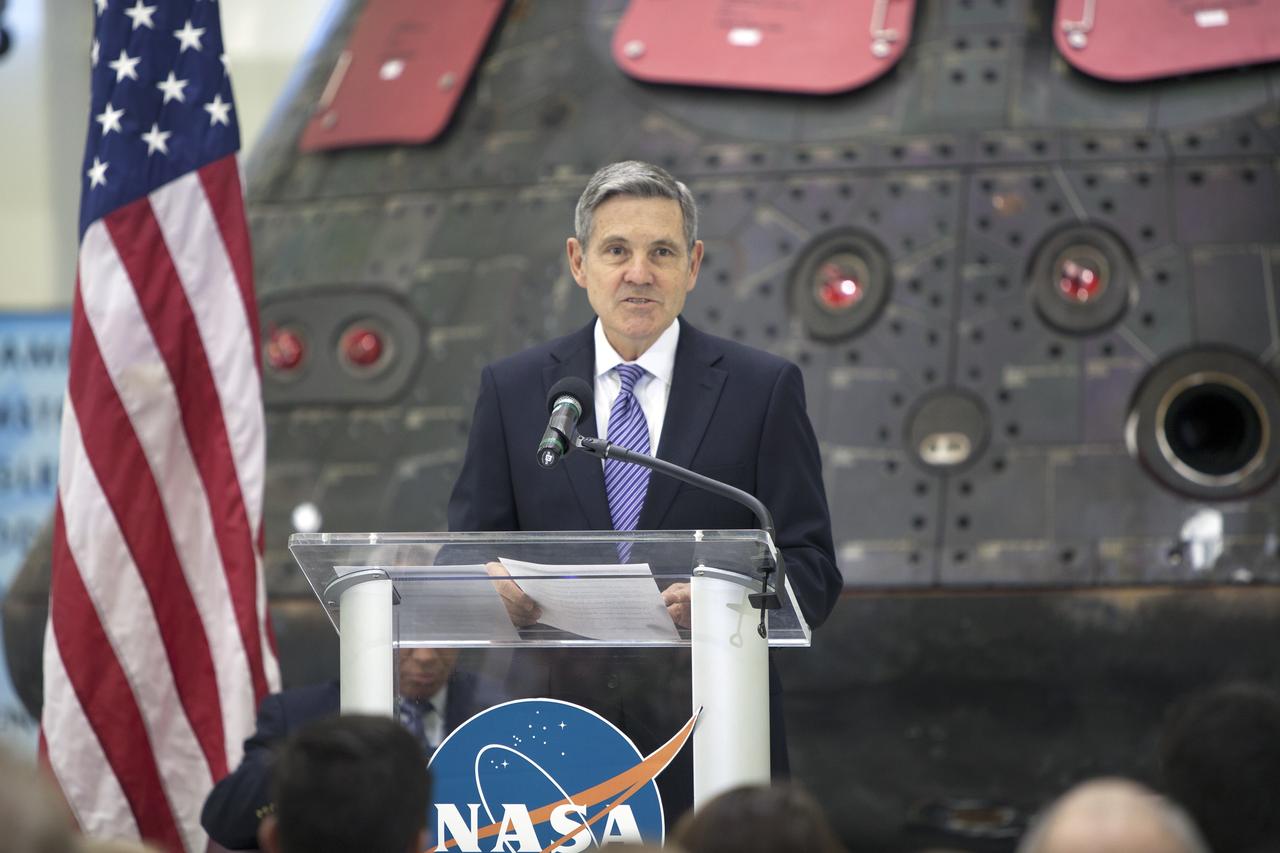 CAPE CANAVERAL, Fla. – In the Neil Armstrong Operations and Checkout Building high bay at NASA's Kennedy Space Center in Florida, Kennedy Space Center Director Bob Cabana makes the opening remarks during a “state of the agency” address at NASA's televised fiscal year 2016 budget rollout event. The address will be delivered by NASA Administrator Charlie Bolden. Representatives from the Kennedy workforce, news media and social media were in attendance. NASA's Orion, SpaceX Dragon and Boeing CST-100 spacecraft, all destined to play a role in NASA’s overall exploration objectives, were on display.  For information on NASA's budget, visit http://www.nasa.gov/budget. Photo credit: NASA/Gianni Woods