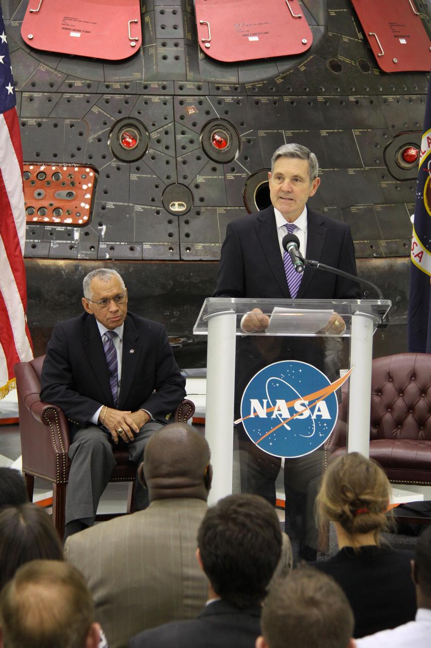 CAPE CANAVERAL, Fla. – In the Neil Armstrong Operations and Checkout Building high bay at NASA's Kennedy Space Center in Florida, Kennedy Space Center Director Bob Cabana introduces NASA Administrator Charlie Bolden, at left, who will deliver a “state of the agency” address at NASA's televised fiscal year 2016 budget rollout event. Representatives from the Kennedy workforce, news media and social media were in attendance. NASA's Orion, SpaceX Dragon and Boeing CST-100 spacecraft, all destined to play a role in NASA’s overall exploration objectives, were on display.  For information on NASA's budget, visit http://www.nasa.gov/budget. Photo credit: NASA/Amber Watson