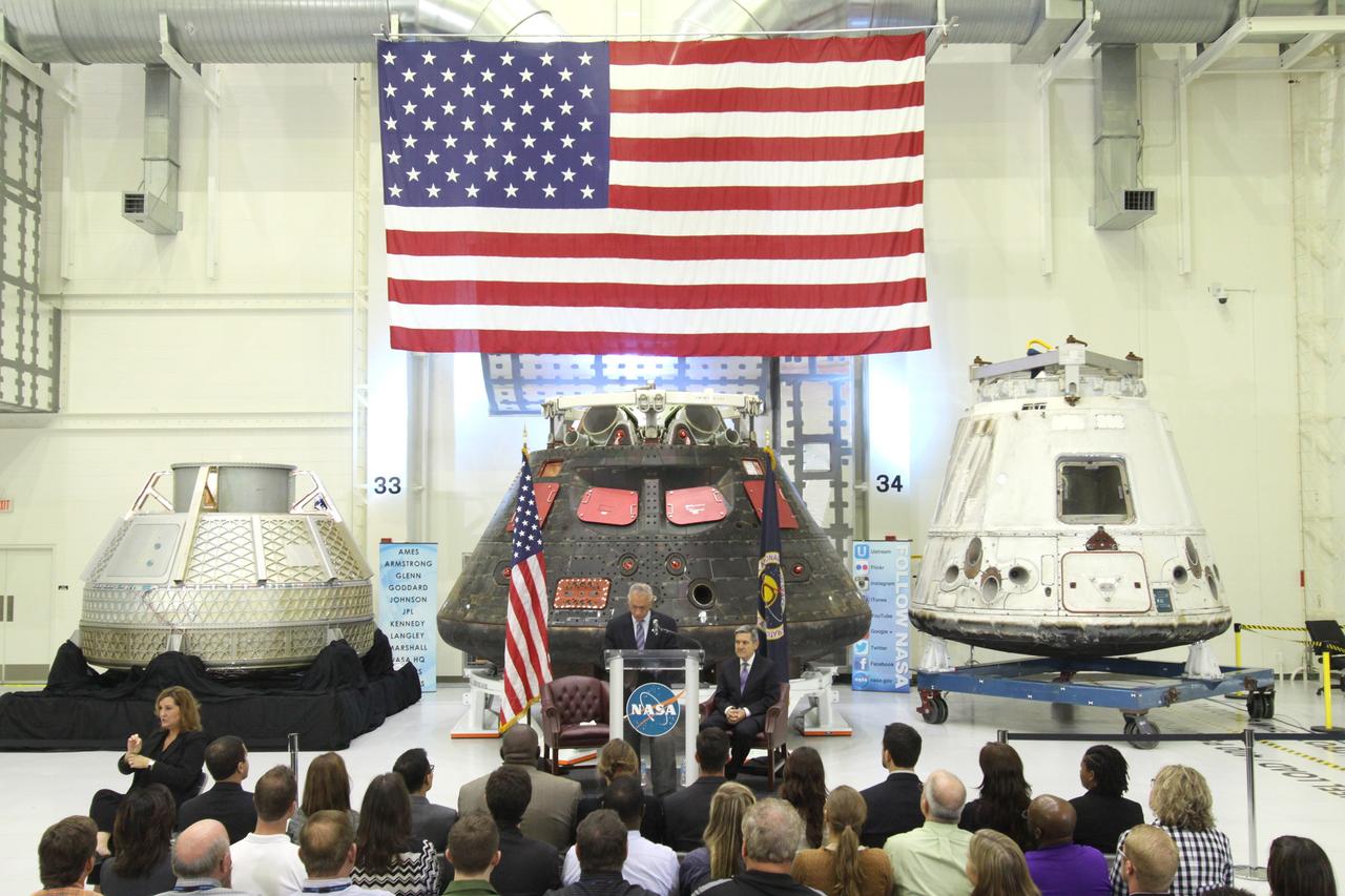 CAPE CANAVERAL, Fla. – In the Neil Armstrong Operations and Checkout Building high bay at NASA's Kennedy Space Center in Florida, NASA Administrator Charlie Bolden delivers a “state of the agency” address at NASA's televised fiscal year 2016 budget rollout event with Kennedy Space Center Director Bob Cabana looking on, at right. Representatives from the Kennedy workforce, news media and social media were in attendance. NASA's Orion, SpaceX Dragon and Boeing CST-100 spacecraft, all destined to play a role in NASA’s overall exploration objectives, were on display.  For information on NASA's budget, visit http://www.nasa.gov/budget. Photo credit: NASA/Amber Watson