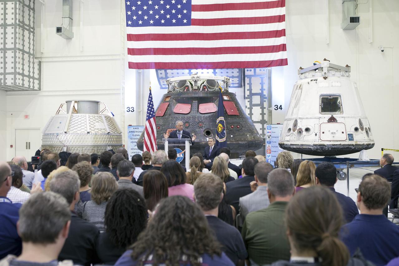 CAPE CANAVERAL, Fla. – In the Neil Armstrong Operations and Checkout Building high bay at NASA's Kennedy Space Center in Florida, NASA Administrator Charlie Bolden delivers a “state of the agency” address at NASA's televised fiscal year 2016 budget rollout event. Kennedy Space Center Director Bob Cabana looks on, at right. Representatives from the Kennedy workforce, news media and social media were in attendance. NASA's Orion, SpaceX Dragon and Boeing CST-100 spacecraft, all destined to play a role in NASA’s overall exploration objectives, were on display.  For information on NASA's budget, visit http://www.nasa.gov/budget. Photo credit: NASA/Gianni Woods