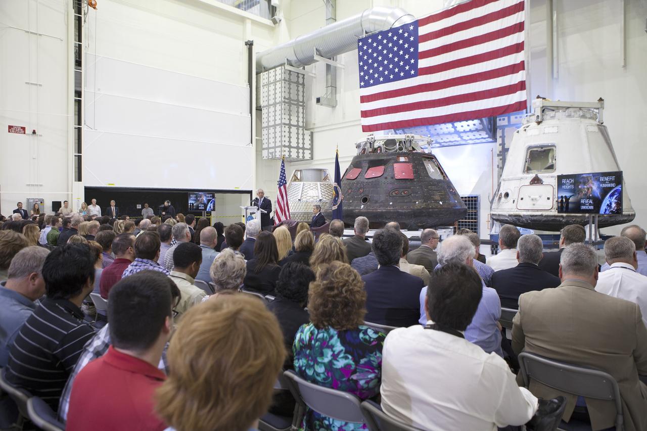 CAPE CANAVERAL, Fla. – In the Neil Armstrong Operations and Checkout Building high bay at NASA's Kennedy Space Center in Florida, NASA Administrator Charlie Bolden delivers a “state of the agency” address at NASA's televised fiscal year 2016 budget rollout event. Kennedy Space Center Director Bob Cabana, seated, made the opening remarks. Representatives from the Kennedy workforce, news media and social media were in attendance. NASA's Orion, SpaceX Dragon and Boeing CST-100 spacecraft, all destined to play a role in NASA’s overall exploration objectives, were on display. For information on NASA's budget, visit http://www.nasa.gov/budget. Photo credit: NASA/Gianni Woods