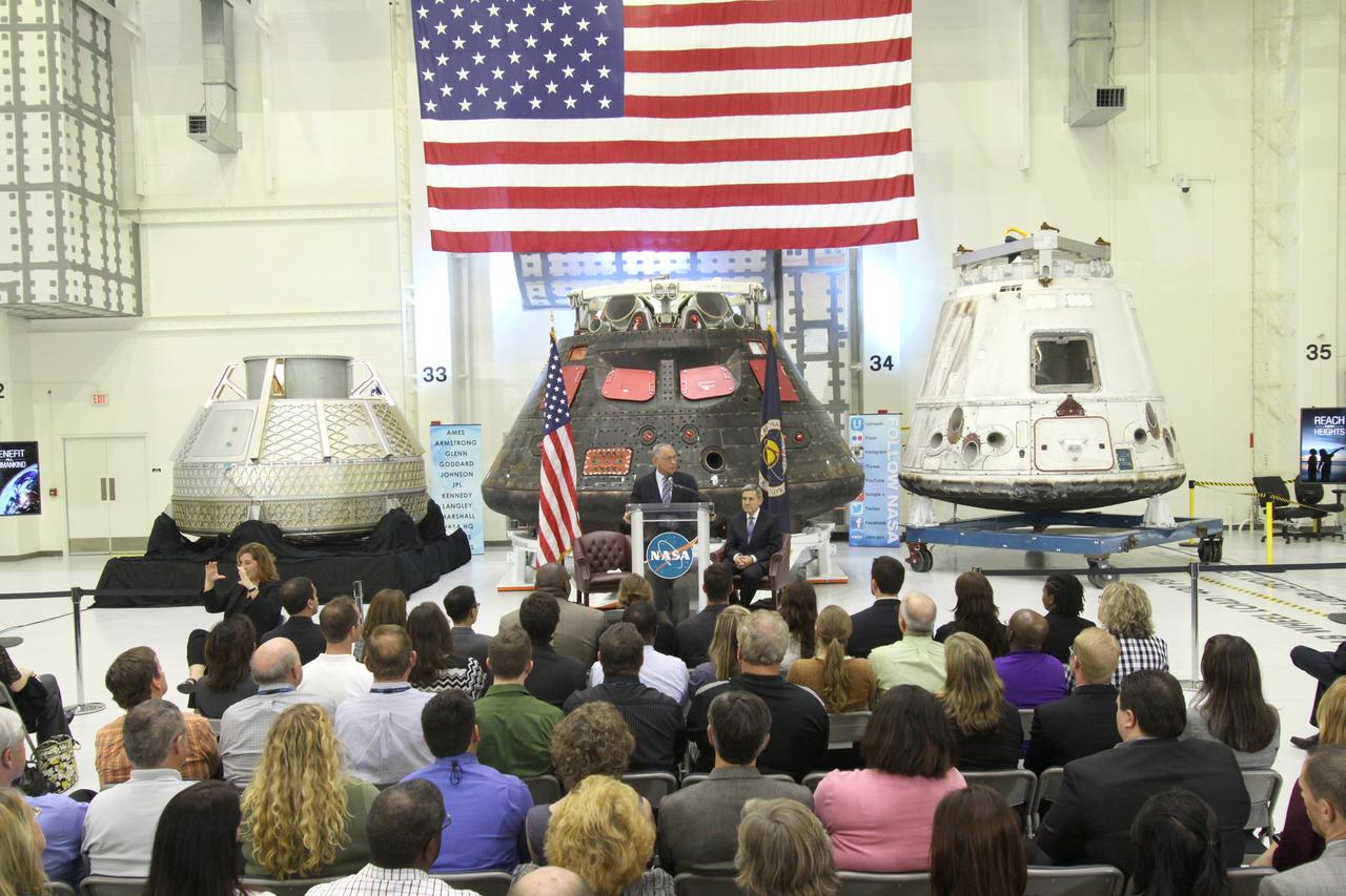 CAPE CANAVERAL, Fla. – In the Neil Armstrong Operations and Checkout Building high bay at NASA's Kennedy Space Center in Florida, NASA Administrator Charlie Bolden delivers a “state of the agency” address at NASA's televised fiscal year 2016 budget rollout event. Kennedy Space Center Director Bob Cabana, seated, made the opening remarks. Representatives from the Kennedy workforce, news media and social media were in attendance. NASA's Orion, SpaceX Dragon and Boeing CST-100 spacecraft, all destined to play a role in NASA’s overall exploration objectives, were on display. For information on NASA's budget, visit http://www.nasa.gov/budget. Photo credit: NASA/Amber Watson