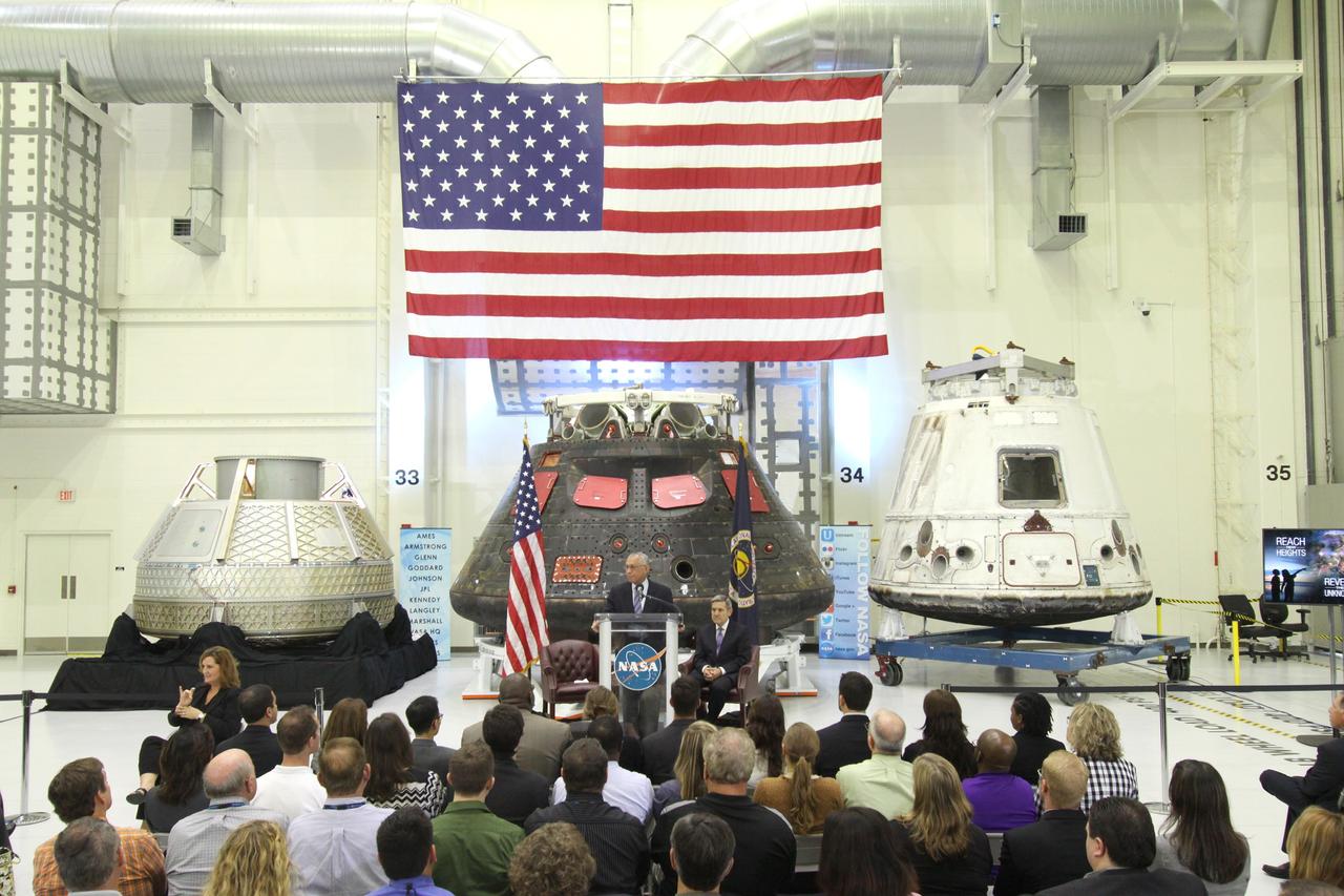 CAPE CANAVERAL, Fla. – In the Neil Armstrong Operations and Checkout Building high bay at NASA's Kennedy Space Center in Florida, NASA Administrator Charlie Bolden delivers a “state of the agency” address at NASA's televised fiscal year 2016 budget rollout event. Kennedy Space Center Director Bob Cabana, seated, made the opening remarks. Representatives from the Kennedy workforce, news media and social media were in attendance. NASA's Orion, SpaceX Dragon and Boeing CST-100 spacecraft, all destined to play a role in NASA’s overall exploration objectives, were on display. For information on NASA's budget, visit http://www.nasa.gov/budget. Photo credit: NASA/Amber Watson