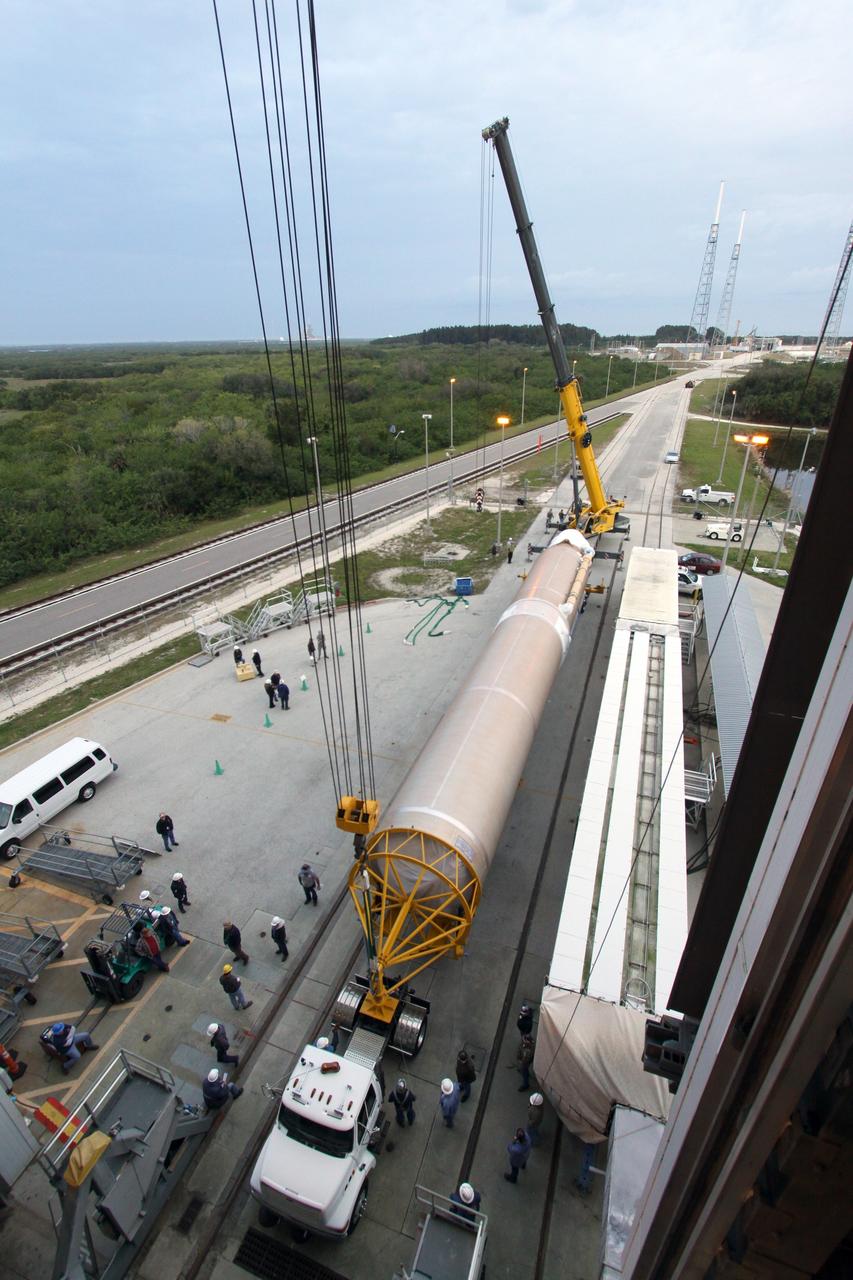 CAPE CANAVERAL, Fla. – Operations are underway at Space Launch Complex 41 on Cape Canaveral Air Force Station in Florida to lift the newly delivered first stage of a United Launch Alliance Atlas V rocket into the mobile service tower. The rocket will launch NASA's Magnetospheric Multiscale mission, or MMS. MMS will study the mystery of how magnetic fields around Earth connect and disconnect, explosively releasing energy via a process known a magnetic reconnection. MMS consists of four identical spacecraft that work together to provide the first three-dimensional view of this fundamental process, which occurs throughout the universe.  Launch is set for March 12. To learn more about MMS, visit http://www.nasa.gov/mms.  Photo credit: NASA/Jim Grossmann