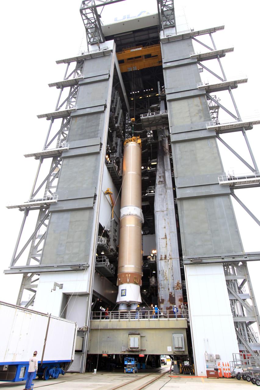 CAPE CANAVERAL, Fla. – The first stage of the United Launch Alliance Atlas V rocket for NASA's Magnetospheric Multiscale mission, or MMS, is positioned on the launch platform in the mobile service tower at Space Launch Complex 41 on Cape Canaveral Air Force Station in Florida. MMS will study the mystery of how magnetic fields around Earth connect and disconnect, explosively releasing energy via a process known a magnetic reconnection. MMS consists of four identical spacecraft that work together to provide the first three-dimensional view of this fundamental process, which occurs throughout the universe.  Launch is set for March 12. To learn more about MMS, visit http://www.nasa.gov/mms.  Photo credit: NASA/Jim Grossmann