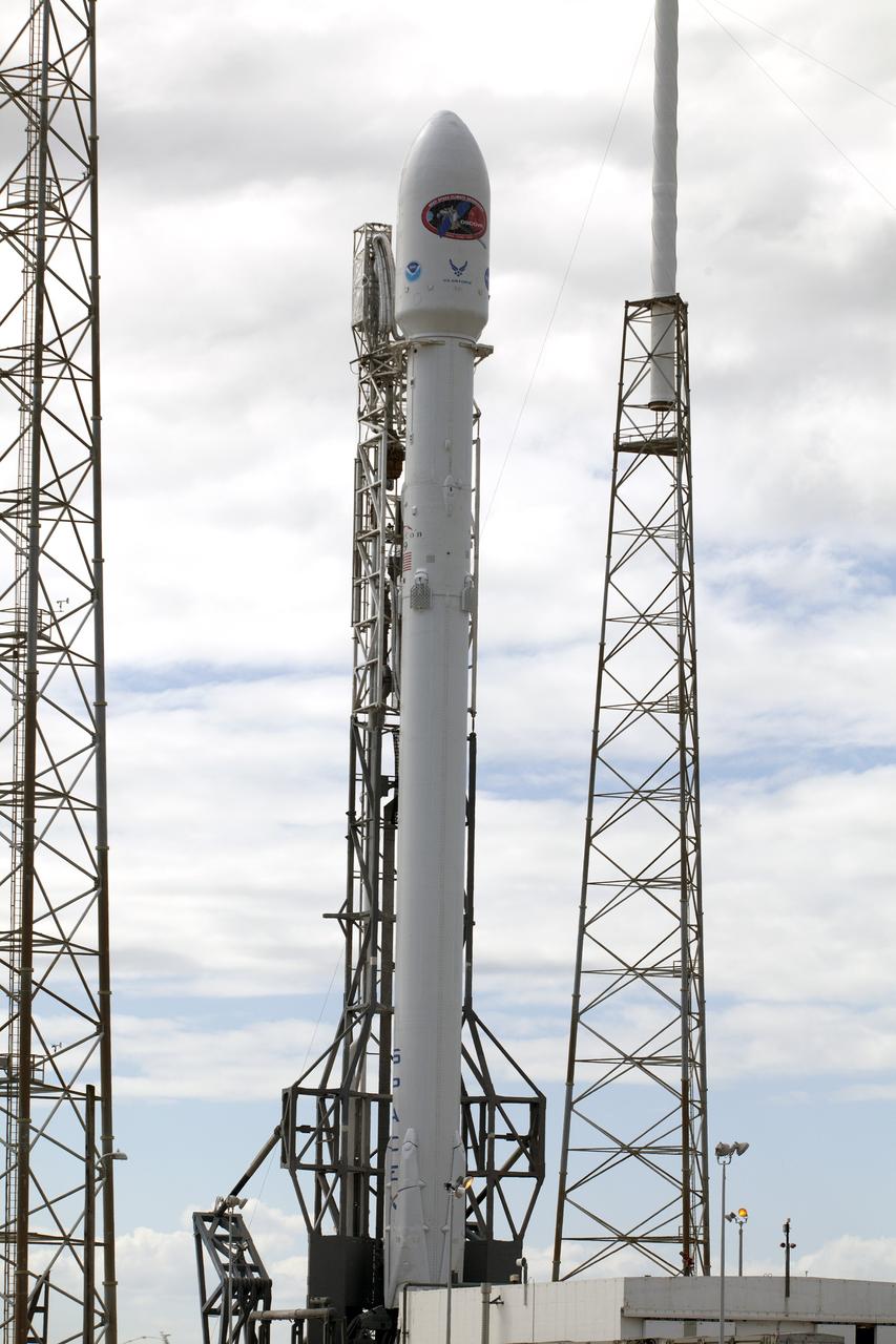 CAPE CANAVERAL, Fla. – The SpaceX Falcon 9 rocket set to launch NOAA’s Deep Space Climate Observatory spacecraft, or DSCOVR, is flanked by lightning masts at Space Launch Complex 40 at Cape Canaveral Air Force Station in Florida. DSCOVR is a partnership between NOAA, NASA and the U.S. Air Force. DSCOVR will maintain the nation's real-time solar wind monitoring capabilities which are critical to the accuracy and lead time of NOAA's space weather alerts and forecasts. To learn more about DSCOVR, visit http://www.nesdis.noaa.gov/DSCOVR. Photo credit: NASA/Kim Shiflett