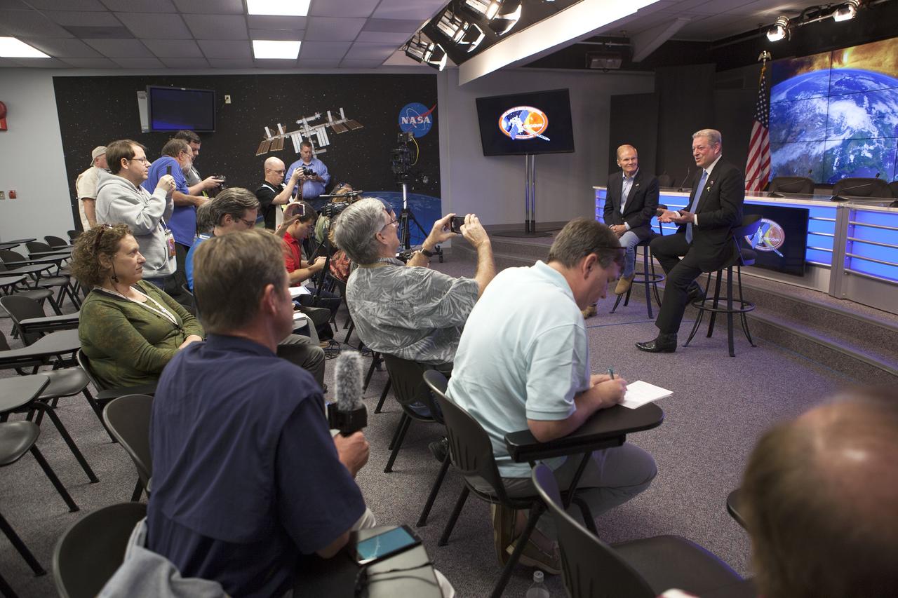 CAPE CANAVERAL, Fla. – Members of the news media listen and take photos at NASA’s Kennedy Space Center in Florida as Sen. Bill Nelson, left, and former Vice President Al Gore, right, answer questions prior to the planned liftoff of NOAA’s Deep Space Climate Observatory spacecraft, or DSCOVR. DSCOVR will launch aboard a SpaceX Falcon 9 rocket. The mission is a partnership between NOAA, NASA and the U.S. Air Force. DSCOVR will maintain the nation's real-time solar wind monitoring capabilities which are critical to the accuracy and lead time of NOAA's space weather alerts and forecasts. To learn more about DSCOVR, visit http://www.nesdis.noaa.gov/DSCOVR. Photo credit: NASA/Kim Shiflett