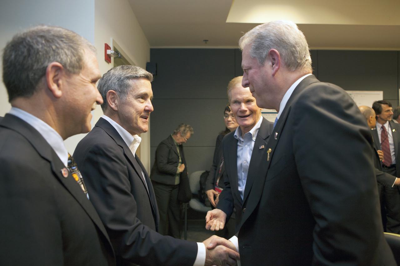 At NASA's Kennedy Space Center in Florida, former Vice President Al Gore, right, shakes the hand of Center Director Bob Cabana before a briefing on NOAA's Deep Space Climate Observatory mission, or DSCOVR. Joining them are John Grunsfeld, left, NASA associate administrator for the Science Mission Directorate, and Sen. Bill Nelson. DSCOVR will launch aboard a SpaceX Falcon 9 rocket. The mission is a partnership between NOAA, NASA and the U.S. Air Force. DSCOVR will maintain the nation's real-time solar wind monitoring capabilities which are critical to the accuracy and lead time of NOAA's space weather alerts and forecasts. To learn more about DSCOVR, visit http://www.nesdis.noaa.gov/DSCOVR. Photo credit: NASA/Kim Shiflett