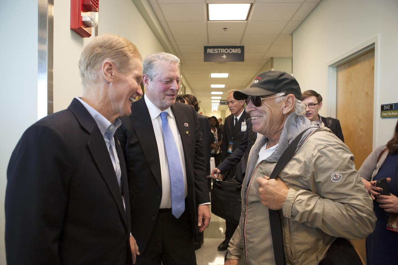 Sen. Bill Nelson, left, and former Vice President Al Gore greet singer Jimmy Buffett, right, at NASA’s Kennedy Space Center in Florida prior to the planned liftoff of NOAA’s Deep Space Climate Observatory mission, or DSCOVR. DSCOVR will launch aboard a SpaceX Falcon 9 rocket. The mission is a partnership between NOAA, NASA and the U.S. Air Force. DSCOVR will maintain the nation's real-time solar wind monitoring capabilities which are critical to the accuracy and lead time of NOAA's space weather alerts and forecasts. To learn more about DSCOVR, visit http://www.nesdis.noaa.gov/DSCOVR. Photo credit: NASA/Kim Shiflett