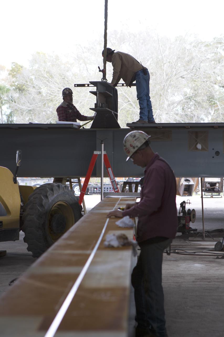 Construction workers at Sauer Co. in Oak Hill, Florida, work on the buildup of the first of 10 new work platforms that will be delivered for installation in high bay 3 of the Vehicle Assembly Building at NASA's Kennedy Space Center in Florida. A contract to modify high bay 3 was awarded by NASA to the Hensel Phelps Construction Co. of Orlando, Florida in March 2014. Sauer is a subcontractor to Hensel Phelps. The Ground Systems Development and Operations Program is overseeing upgrades and modifications to the high bay to support processing of NASA's Space Launch System and Orion spacecraft, and other exploration vehicles. Photo credit: NASA/Ben Smegelsky