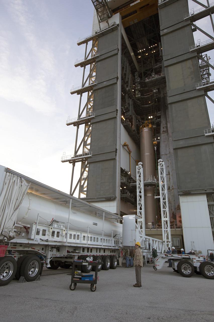 A solid rocket motor for the United Launch Alliance Atlas V rocket slated to boost NASA's Magnetospheric Multiscale mission, or MMS, arrives at the mobile service tower at Space Launch Complex 41 on Cape Canaveral Air Force Station in Florida. Four identical MMS spacecraft will study the mystery of how magnetic fields around Earth connect and disconnect, explosively releasing energy via a process known a magnetic reconnection. Launch is set for March 12. To learn more: http://www.nasa.gov/mms. Photo credit: NASA/ Kim Shiflett