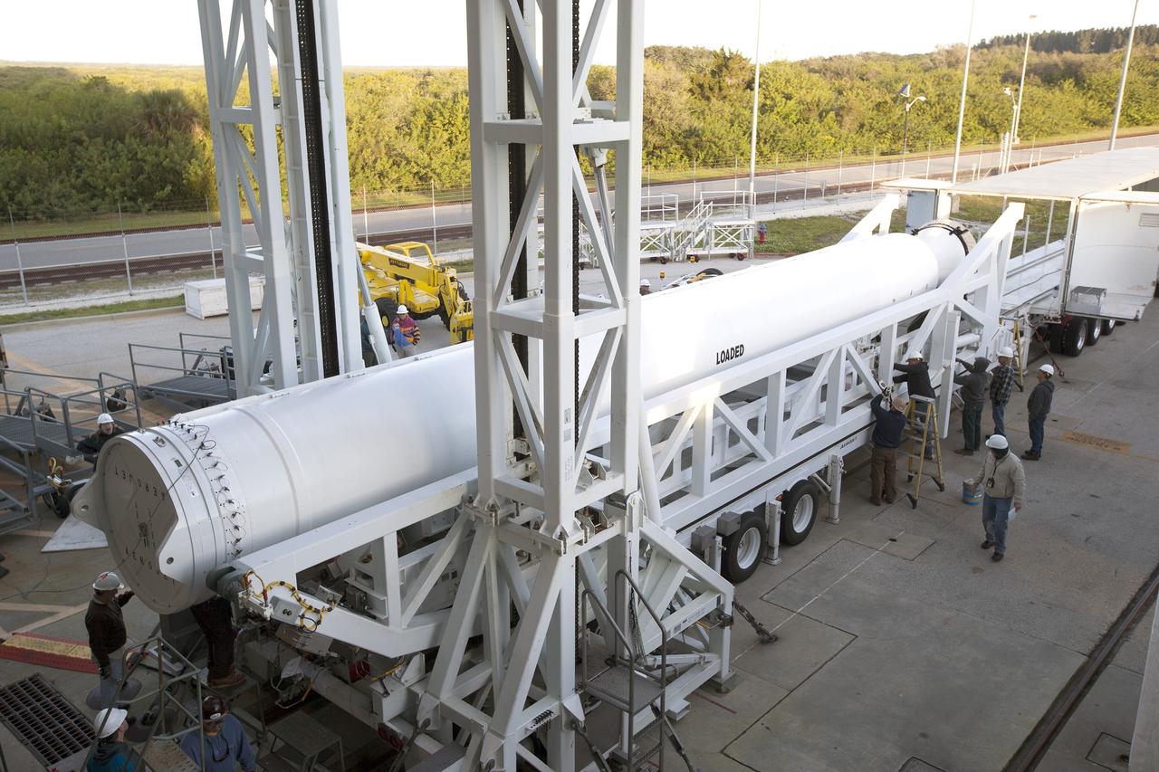 A solid rocket motor for the United Launch Alliance Atlas V rocket slated to boost NASA's Magnetospheric Multiscale mission, or MMS, arrives at the mobile service tower at Space Launch Complex 41 on Cape Canaveral Air Force Station in Florida. Four identical MMS spacecraft will study the mystery of how magnetic fields around Earth connect and disconnect, explosively releasing energy via a process known a magnetic reconnection. Launch is set for March 12. To learn more: http://www.nasa.gov/mms. Photo credit: NASA/ Kim Shiflett