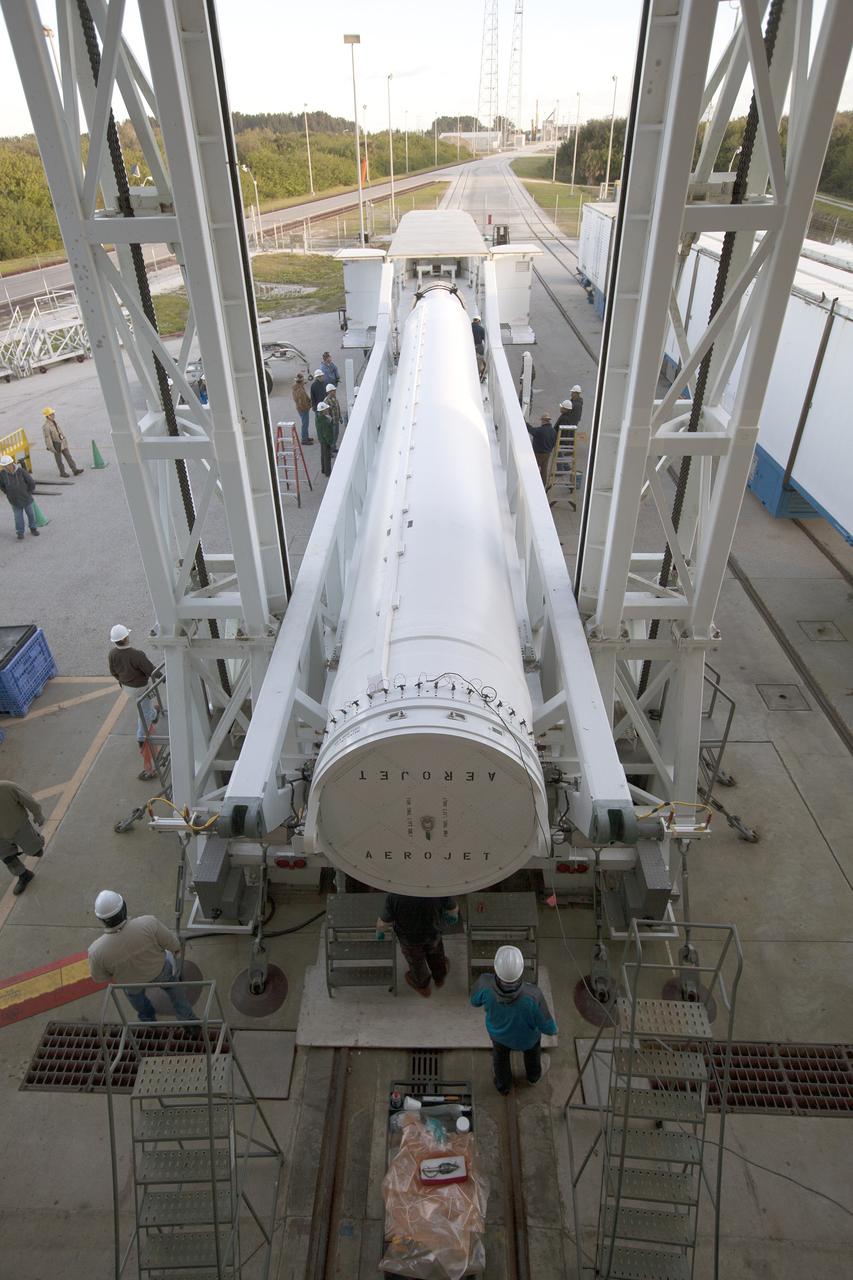 A solid rocket motor for the United Launch Alliance Atlas V rocket slated to boost NASA's Magnetospheric Multiscale mission, or MMS, arrives at the mobile service tower at Space Launch Complex 41 on Cape Canaveral Air Force Station in Florida. Four identical MMS spacecraft will study the mystery of how magnetic fields around Earth connect and disconnect, explosively releasing energy via a process known a magnetic reconnection. Launch is set for March 12. To learn more: http://www.nasa.gov/mms. Photo credit: NASA/ Kim Shiflett