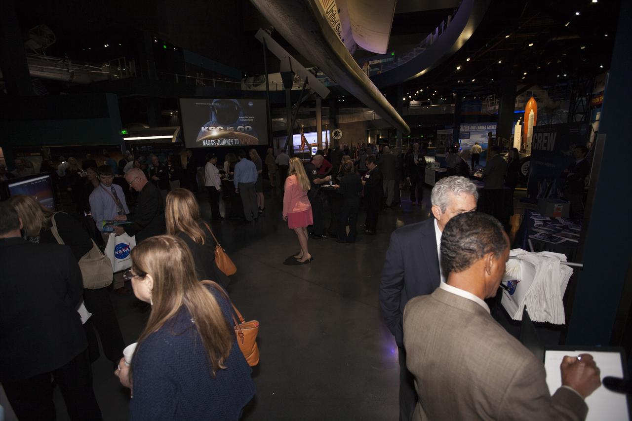 In the Space Shuttle Atlantis exhibit facility at the Kennedy Space Center's Visitor Complex, guests are briefed on work taking place in the Florida spaceport. This followed a presentation by center director Bob Cabana who updated community leaders on current and future activities at the space center.