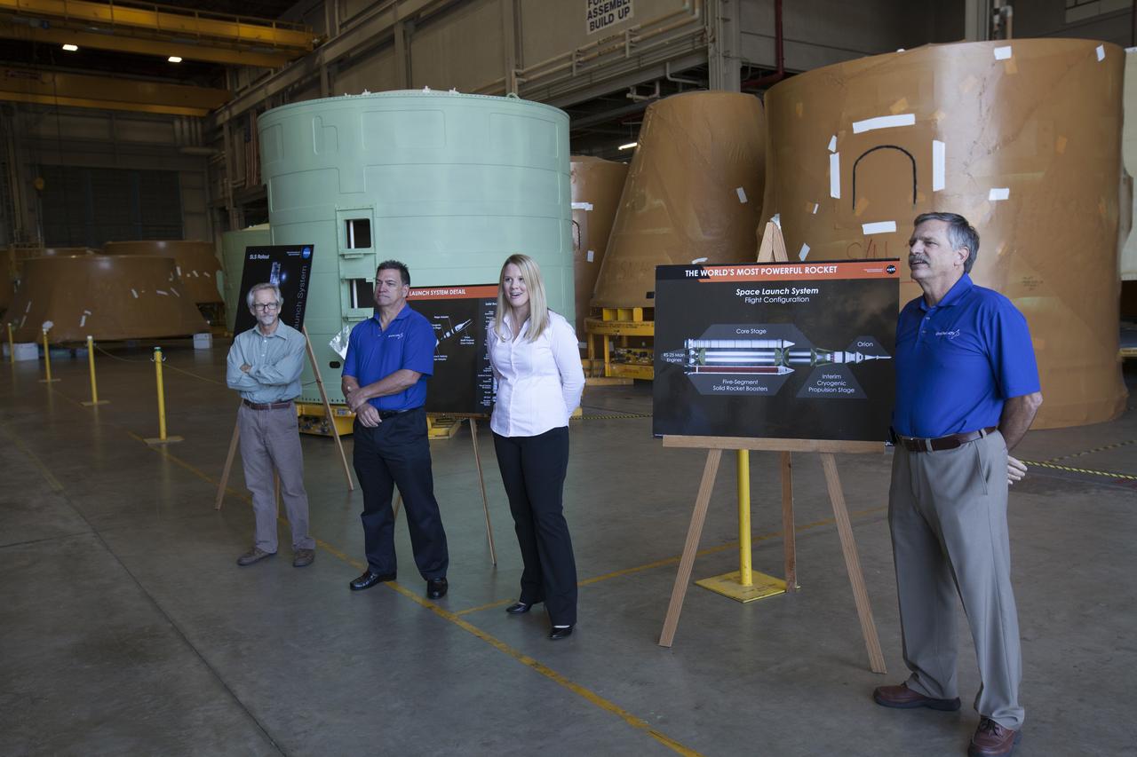 Bethany March, an element integration engineer at NASA’s Marshall Space Flight Center (MSFC) in Alabama, speaks to members of the news media during a tour of the Booster Fabrication Facility (BFF) at NASA’s Kennedy Space Center in Florida. Orbital ATK is a contractor for MSFC, and operates the BFF to prepare aft booster segments and hardware for the agency’s Space Launch System (SLS) solid rocket boosters. To her right is Rick Serfozo, Orbital ATK Florida site director. The SLS rocket and Orion spacecraft will launch on Exploration Mission-1 in 2018. The Ground Systems Development and Operations Program is preparing the infrastructure to process and launch spacecraft for deep-space missions and the journey to Mars.