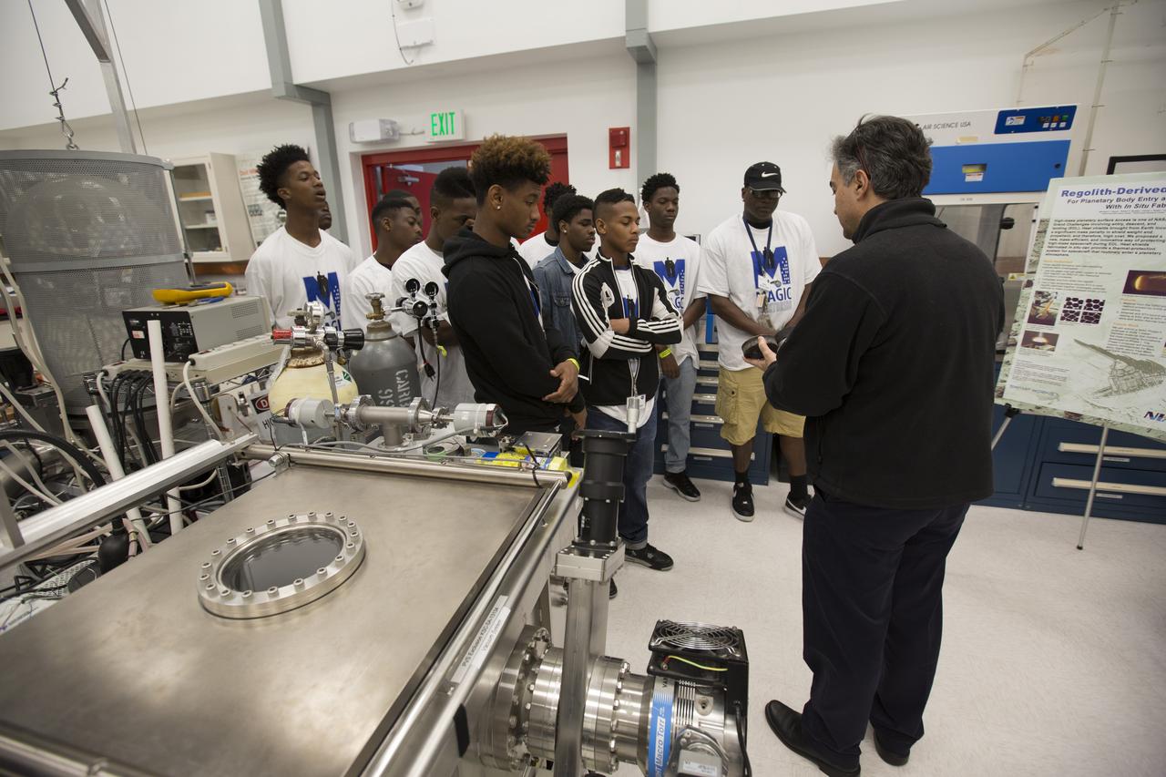 Students in the My Brother’s Keeper program watch as Jose Nunez of NASA Kennedy Space Center’s Exploration Research and Technology Programs demonstrates some of the hardware in the Electrostatic and Surface Physics Lab at the Florida spaceport. Kennedy is one of six NASA centers that participated in My Brother’s Keeper National Lab Week. The event is a nationwide effort to bring youth from underrepresented communities into federal labs and centers for hands-on activities, tours and inspirational speakers. Sixty students from the nearby cities of Orlando and Sanford visited Kennedy, where they toured the Vehicle Assembly Building, the Space Station Processing Facility and the center’s innovative Swamp Works Labs. The students also had a chance to meet and ask questions of a panel of subject matter experts from across Kennedy.
