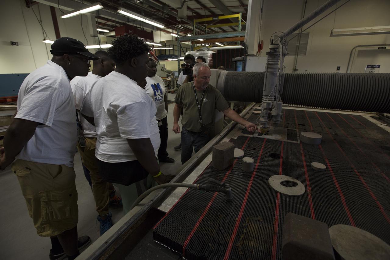 Harold (Russ) McAmis demonstrates machinery inside NASA Kennedy Space Center’s Prototype Lab for students in the My Brother’s Keeper program. The Florida spaceport is one of six NASA centers that participated in My Brother’s Keeper National Lab Week. The event is a nationwide effort to bring youth from underrepresented communities into federal labs and centers for hands-on activities, tours and inspirational speakers. Sixty students from the nearby cities of Orlando and Sanford visited Kennedy, where they toured the Vehicle Assembly Building, the Space Station Processing Facility and the center’s innovative Swamp Works Labs. The students also had a chance to meet and ask questions of a panel of subject matter experts from across Kennedy. 