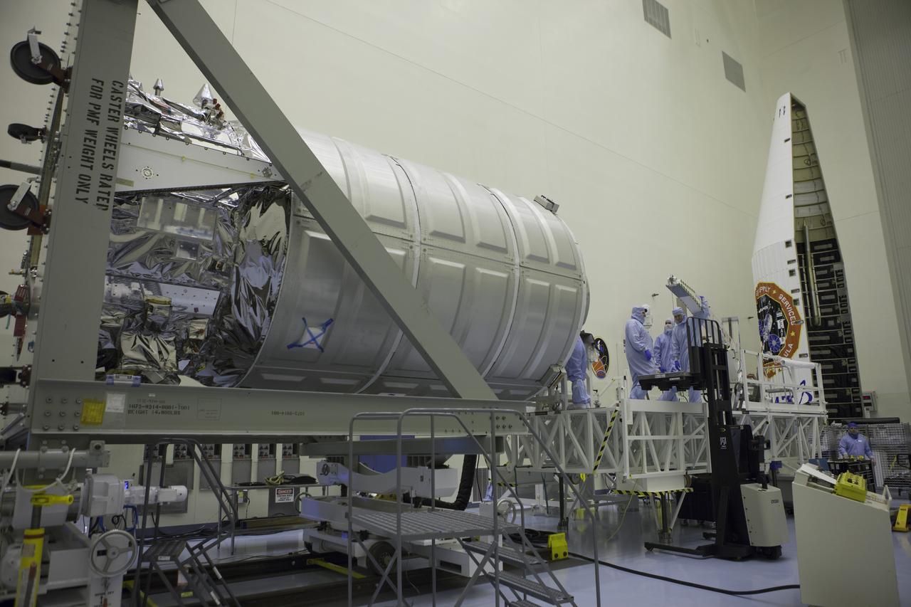 Technicians prepare load cargo into the Orbital ATK Cygnus pressurized module during late stowage operations inside the Payload Hazardous Servicing Facility at NASA's Kennedy Space Center in Florida. The spacecraft is scheduled for the upcoming Orbital ATK Commercial Resupply Services-6 mission to deliver hardware and supplies to the International Space Station. The Cygnus is scheduled to lift off atop a United Launch Alliance Atlas V rocket on March 22. 