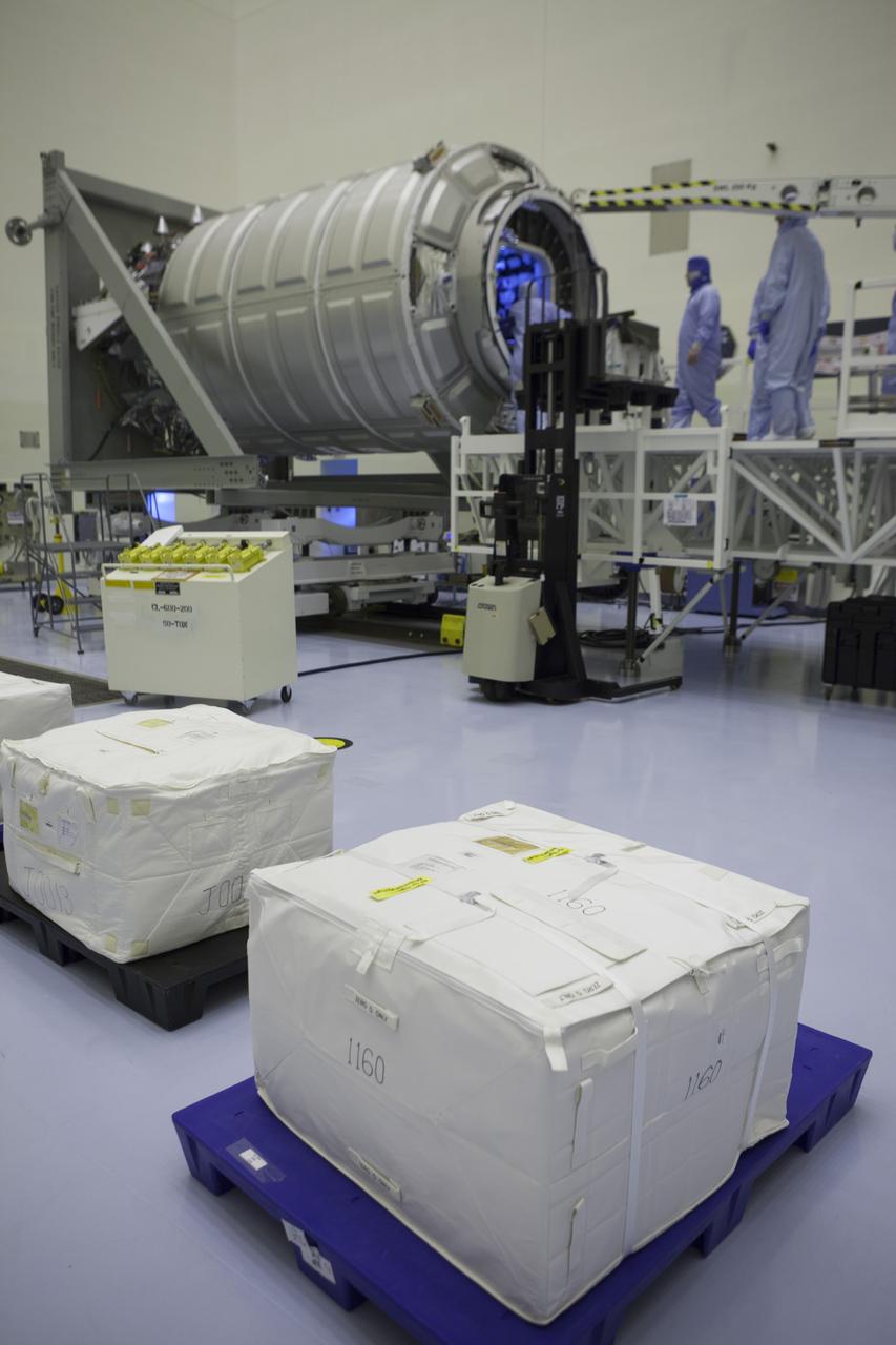 Carefully packaged cargo waits on pallets inside the Payload Hazardous Servicing Facility at NASA’s Kennedy Space Center in Florida. In the background, technicians prepare to begin loading the cargo into the Orbital ATK Cygnus pressurized module during late stowage operations. The spacecraft is scheduled for the upcoming Orbital ATK Commercial Resupply Services-6 mission to deliver hardware and supplies to the International Space Station. The Cygnus is scheduled to lift off atop a United Launch Alliance Atlas V rocket on March 22.
