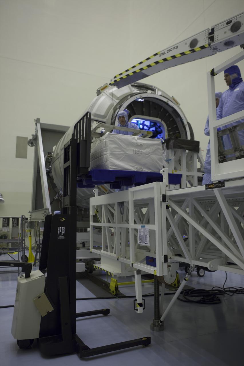 Technicians prepare to move a cargo package from a forklift into the Orbital ATK CRS-6 pressurized cargo module during late stowage inside the Payload Hazardous Servicing Facility at NASA’s Kennedy Space Center in Florida. The spacecraft is scheduled for the upcoming Orbital ATK Commercial Resupply Services-6 mission to deliver hardware and supplies to the International Space Station. The Cygnus is scheduled to lift off atop a United Launch Alliance Atlas V rocket on March 22. 